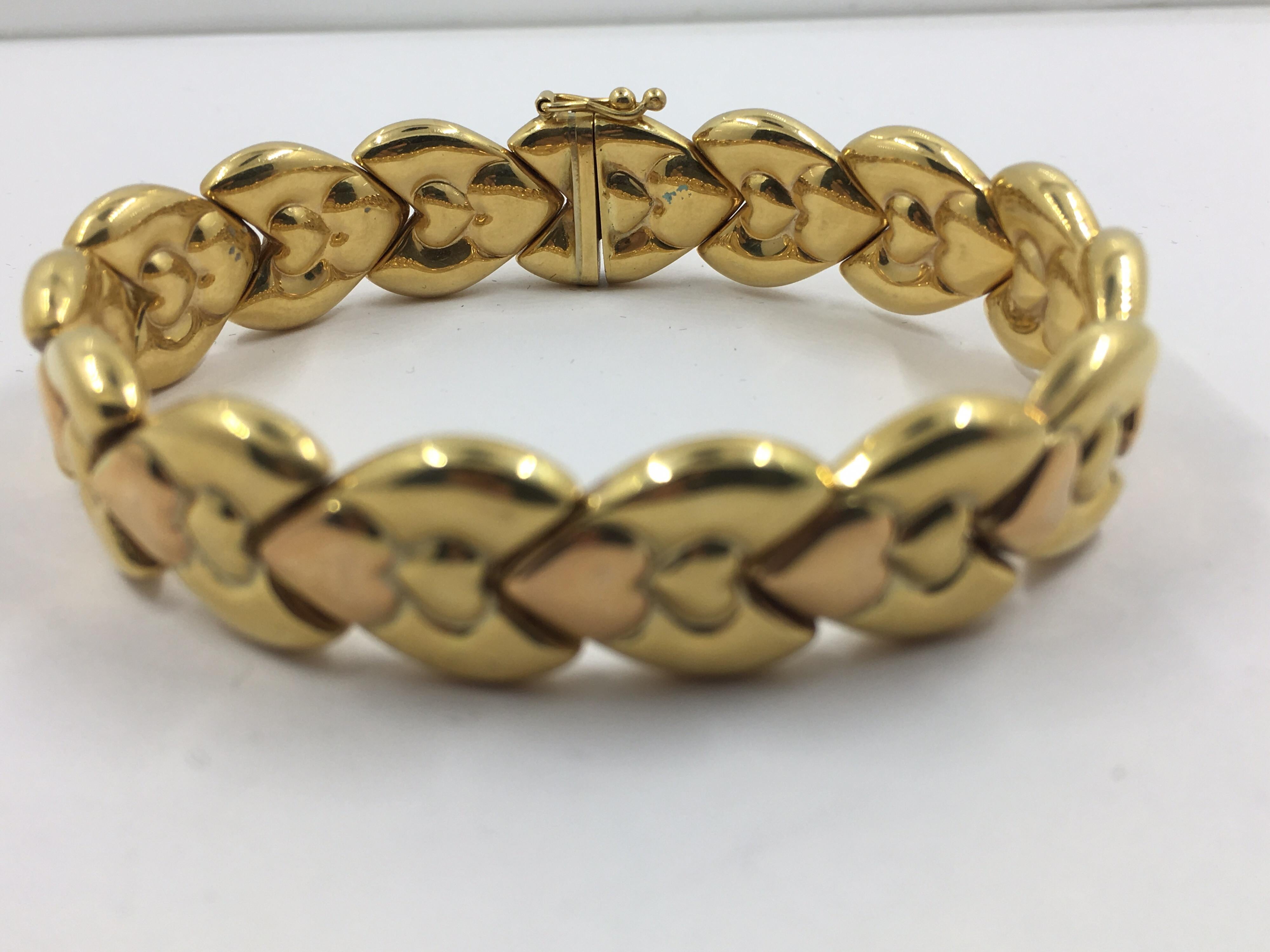 14 Kt Gold Bracelet
1 side is all yellow
flip side is pink and yellow gold
can be worn on either side