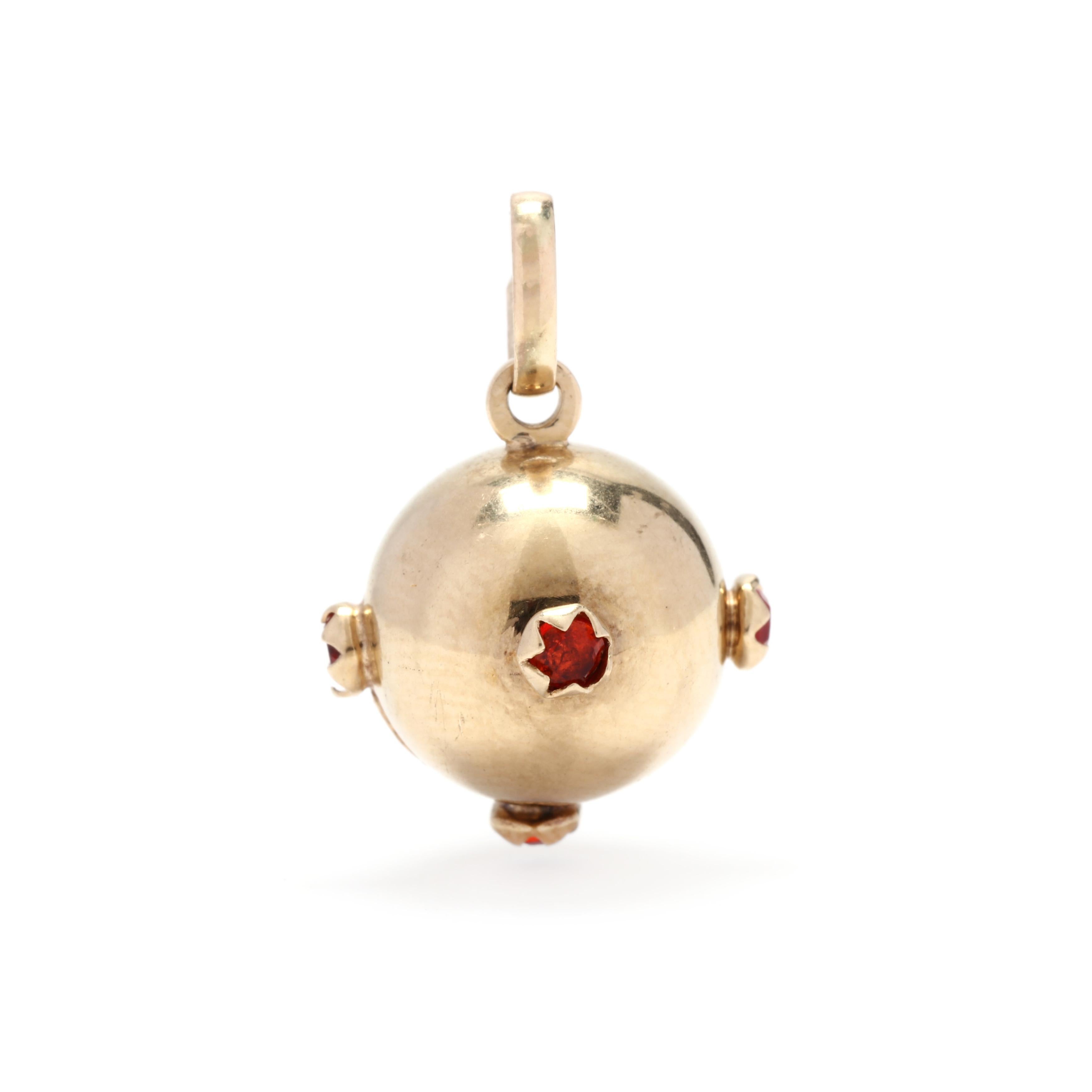 A vintage 14 karat yellow gold red stone orb charm. This charm features a round, orb charm with multiple prong set red stones and an oval bail.



Length: 7/8 in.



Width: 9/16 in.



Weight: 1.2 dwts.