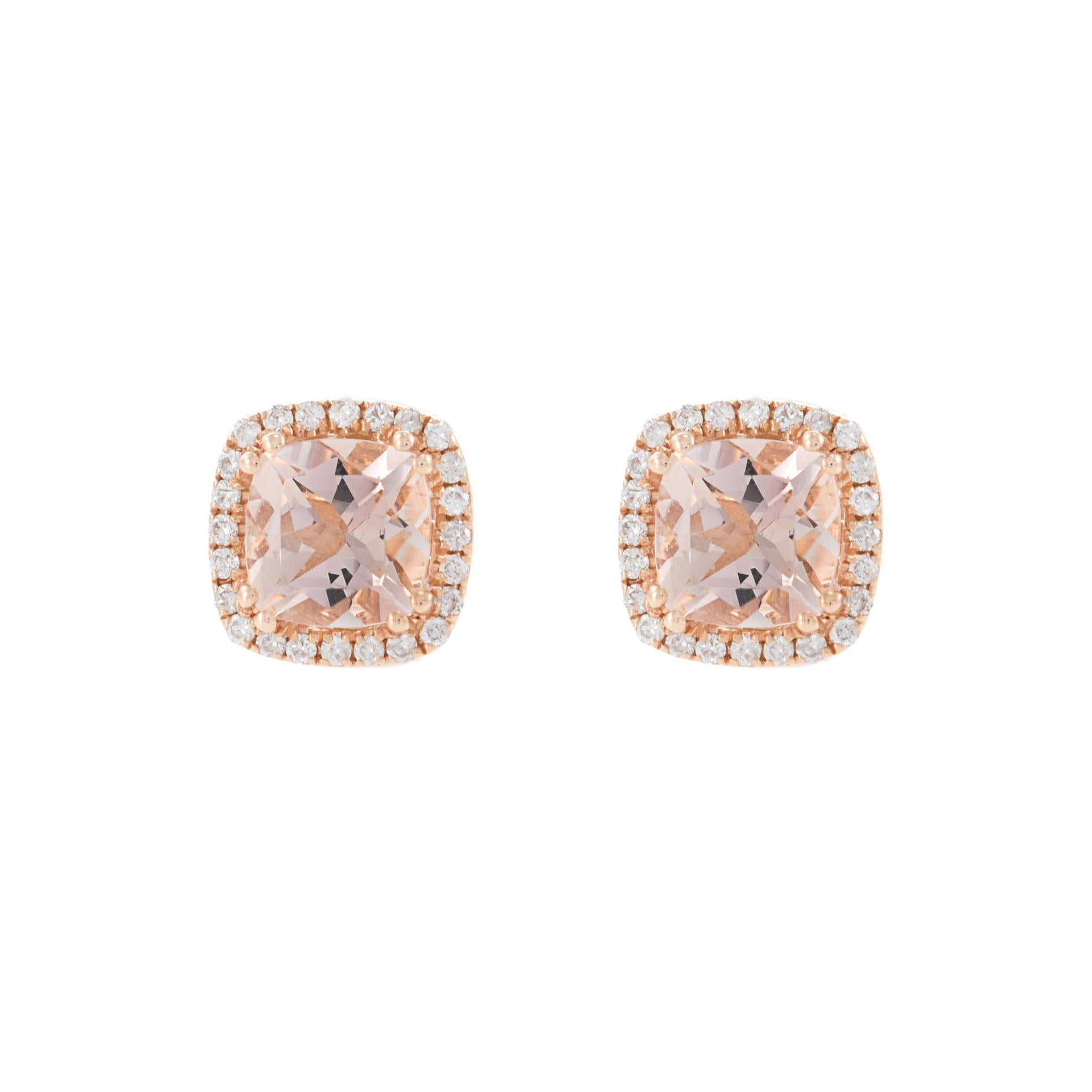 14KT Rose Gold Cushion Cut Morganite and Diamond Halo Earrings. These stunning earrings feature 1.58 carats total weight of cushion cut morganites, beautifully surrounded by 0.18 carats total weight of round cut diamonds. The warm hue of the rose