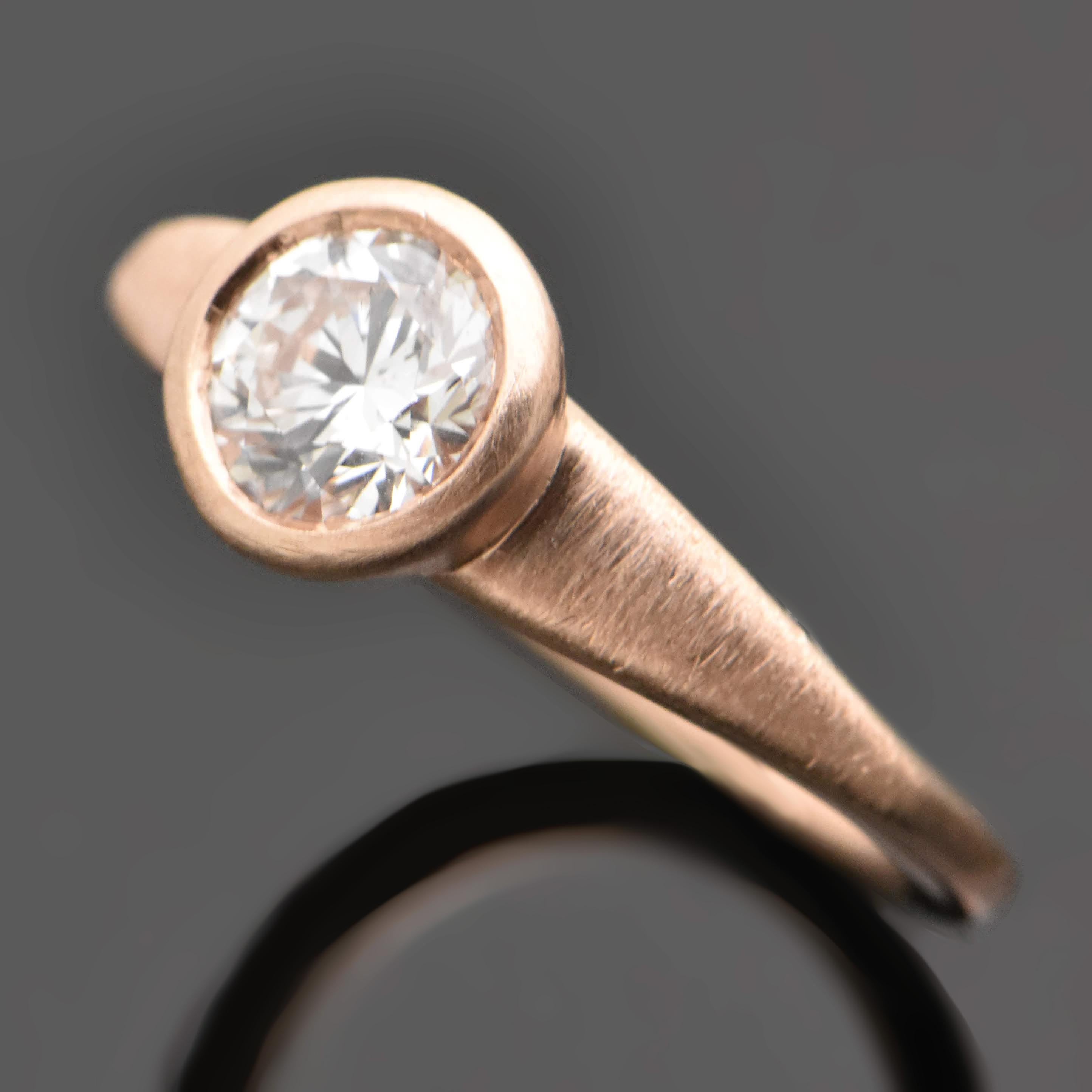 14kt Rose Gold Diamonds Ring. This ring is a low-profile classic design featuring a bezel-set diamond with brushed rose gold setting that tapers from shoulders. 

This item is a custom order only. Price is for the ring setting only. The stone will