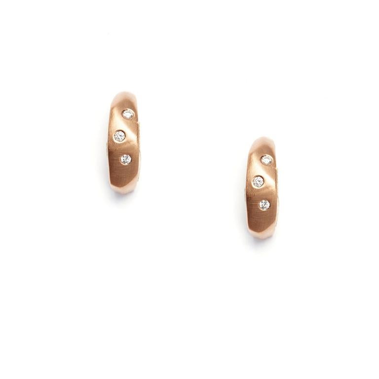 These earrings show a mastery of style - sleek 14 Karat Rose Gold, shimmering Diamonds and sublime texture complement The Diana Band, part of The Diana Band Collection, named for Susan's first-born daughter.

Available in 14 Karat Rose Gold, 14