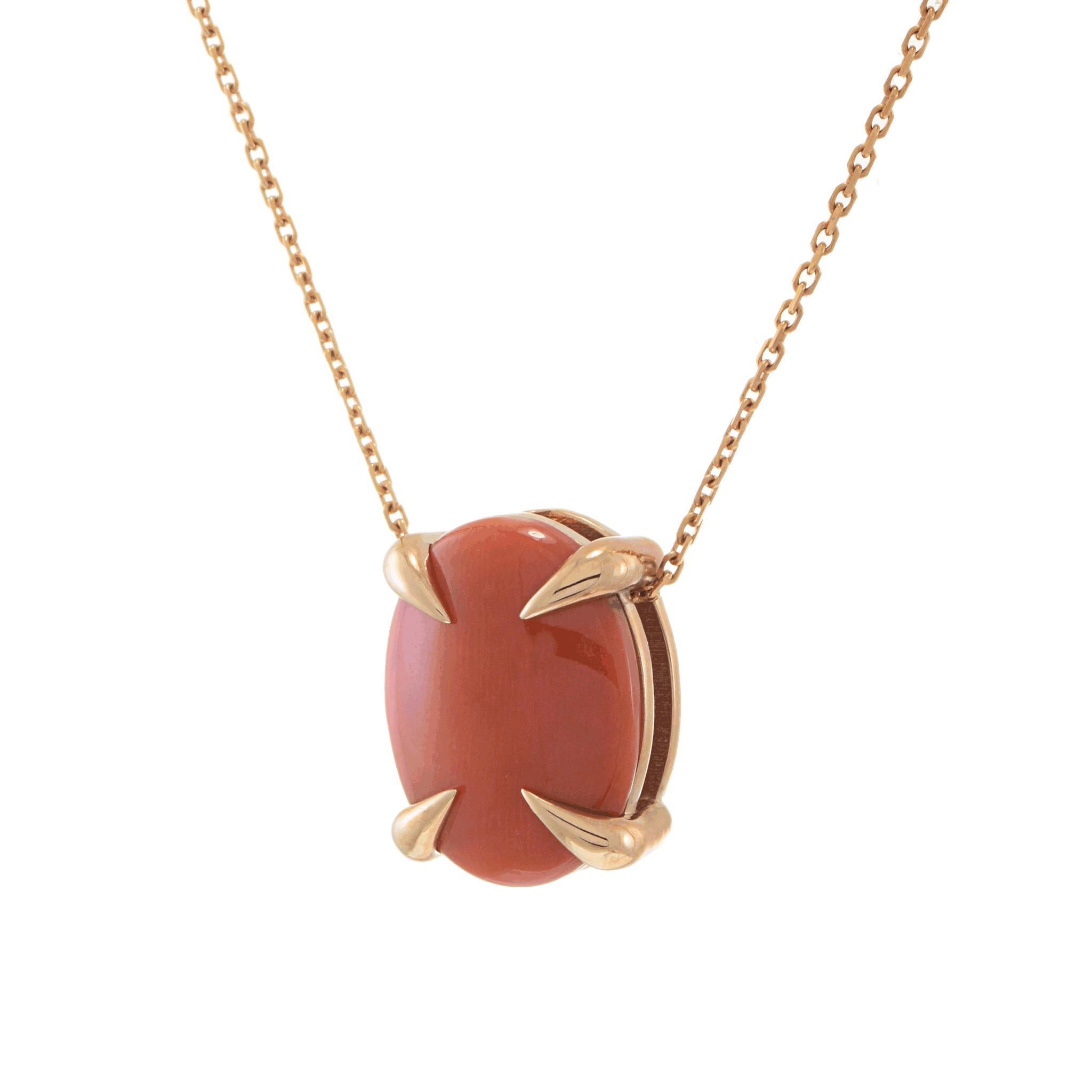 Experience the refined simplicity of this Coral Pendant Necklace.
Made with 14k rose gold, the necklace features an oval-cut red coral as its centerpiece.

The design is minimalistic, with four prongs elegantly securing the coral, highlighting its
