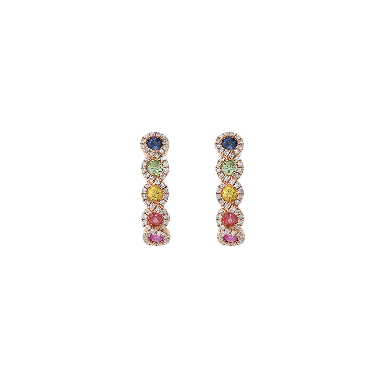 These 14kt rose gold huggie earrings are adorned with a colorful array of round-cut sapphires, totaling 0.65 carats, in various hues. Surrounding the sapphires are round-cut diamonds, with a combined weight of 0.24 carats, adding a touch of
