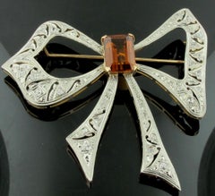 14 Karat Rose Gold and Platinum Citrine and Diamond "Bow" Brooch, circa 1930