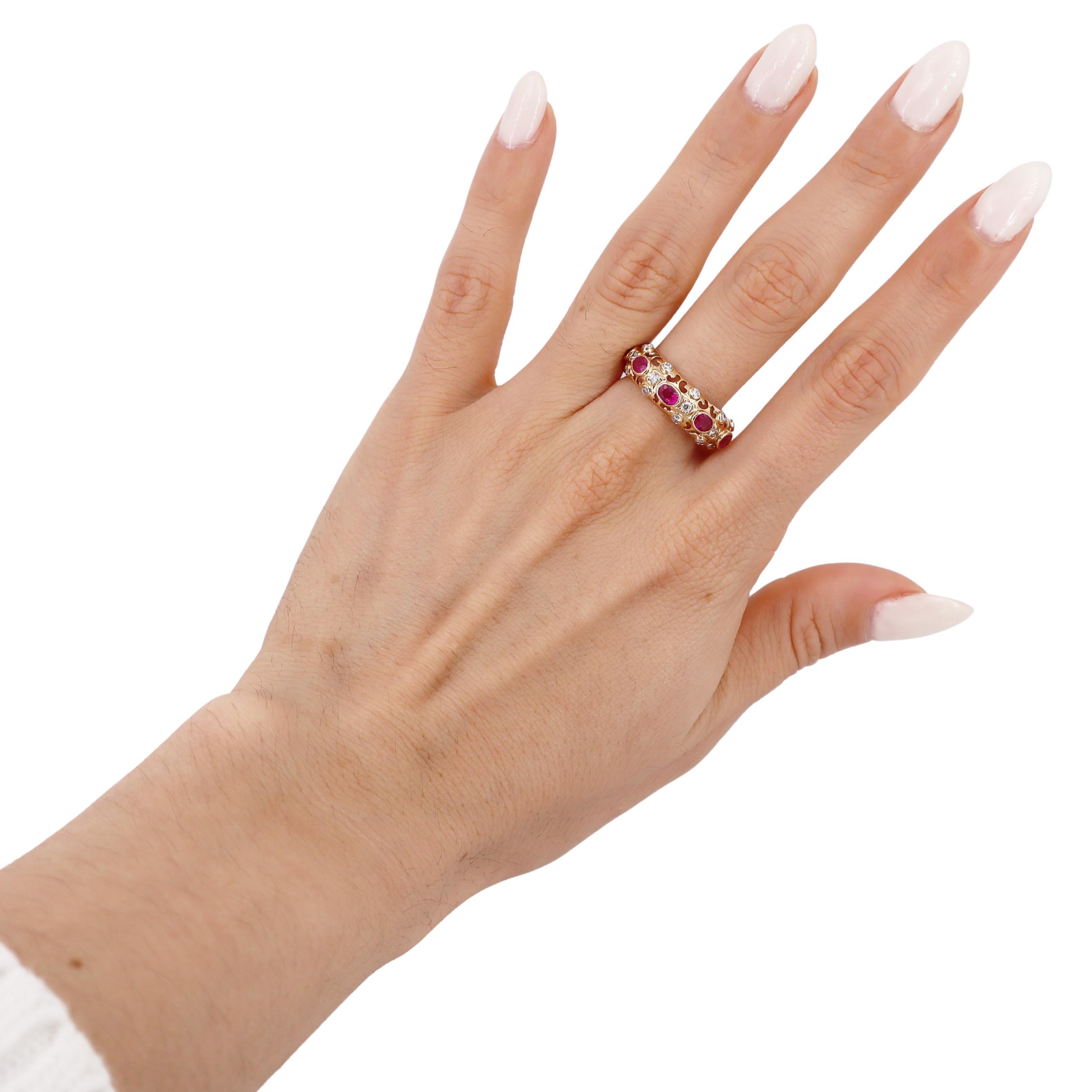 Experience elegance with this stunning 14kt yellow gold band ring, designed to make a statement. This exquisite piece features nine oval cut Burma rubies, which collectively weigh approximately 2.21 carats. Renowned for their deep, vibrant red hue,