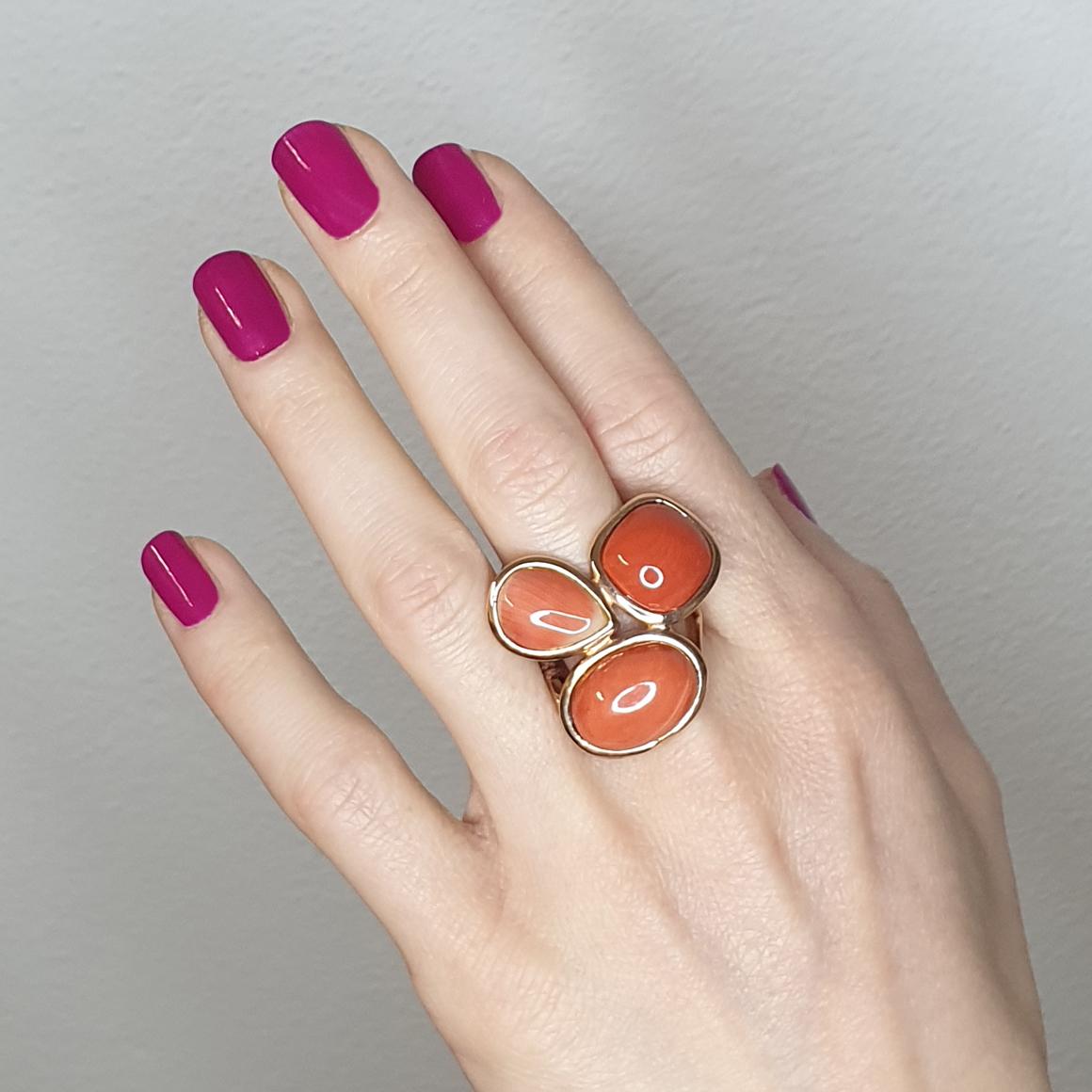  Combination of shapes and red color made a unique fashion and modern ring in 14k rose gold with Red Coral. Made in Italy by Stanoppi Jewellery since 1948.

(square cabochon cut, size: 13x13 mm; Oval cabochon cut, size: 12x16 mm, drop 10x14)  