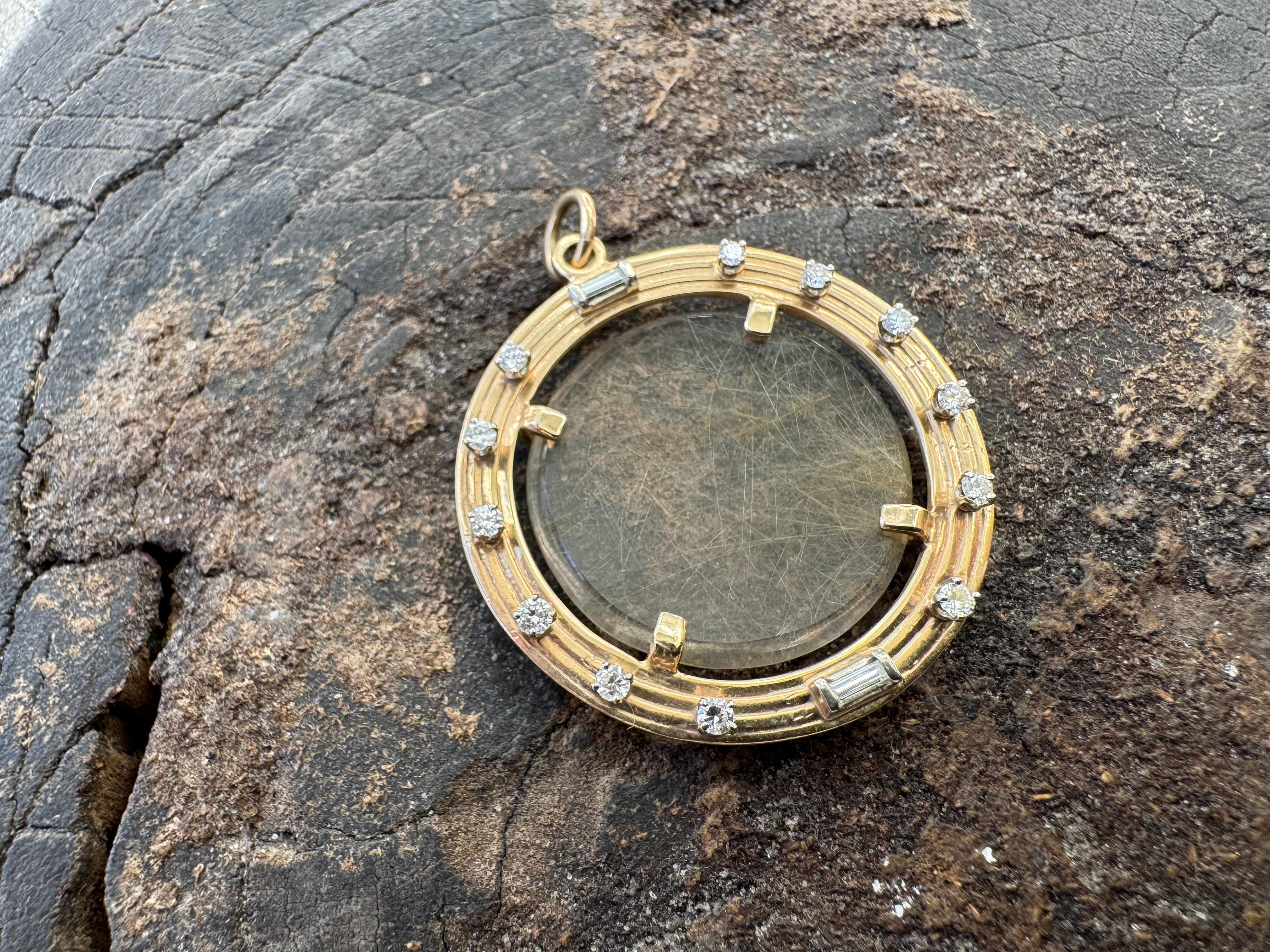 14kt rutilated Quartz, gold and diamond pendant
11 g gold
1.5