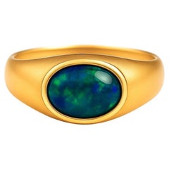 14kt solid gold ring with opal cabochon.
