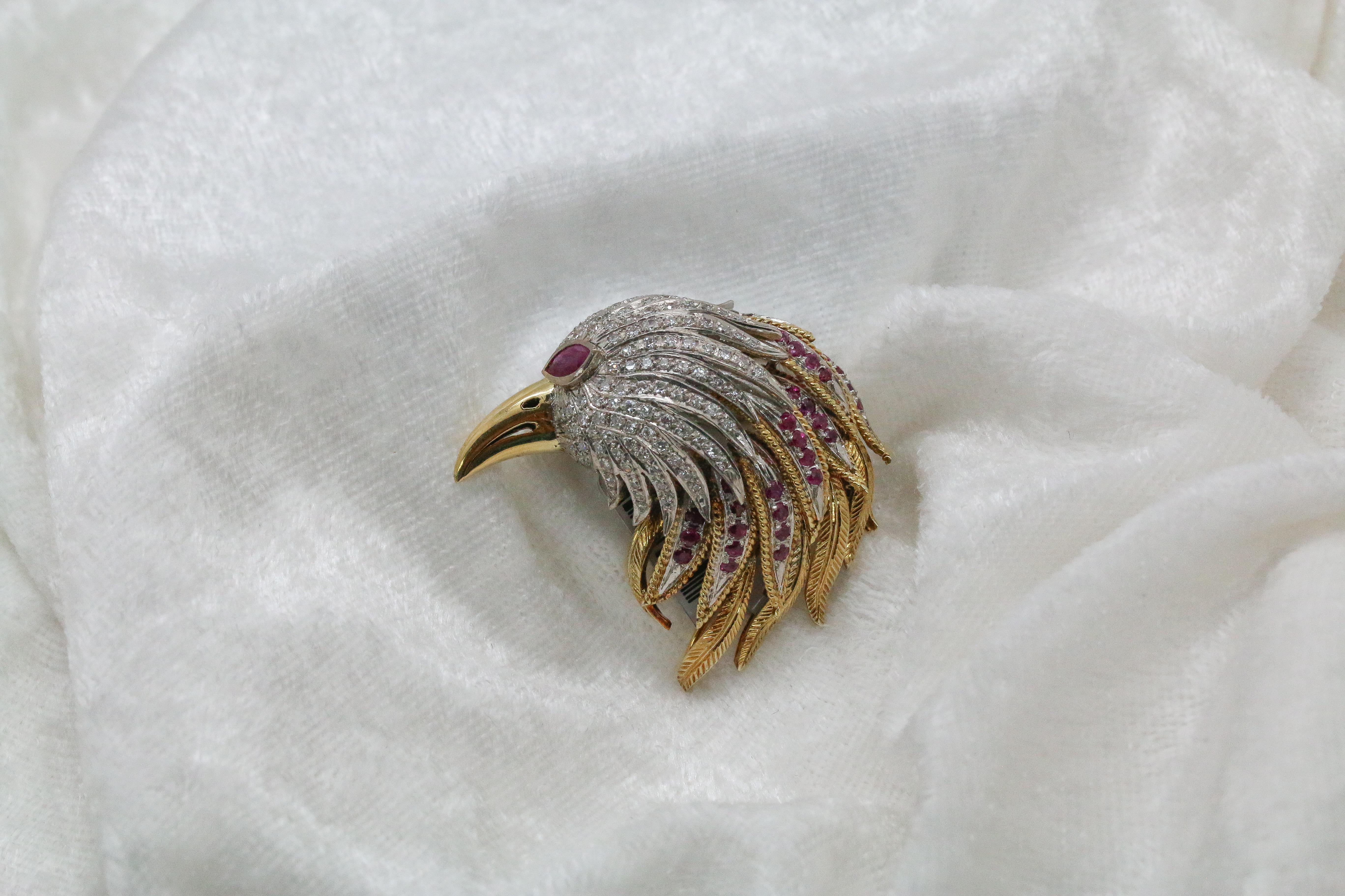 Showcasing a stunning, large and impressive 14kt Two-Tone White & Yellow Gold Bird Estate Brooch featuring natural round Rubies .28ct and natural round Diamonds .01ct with a beautiful all natural marquise cut Ruby for the eye of the bird. This