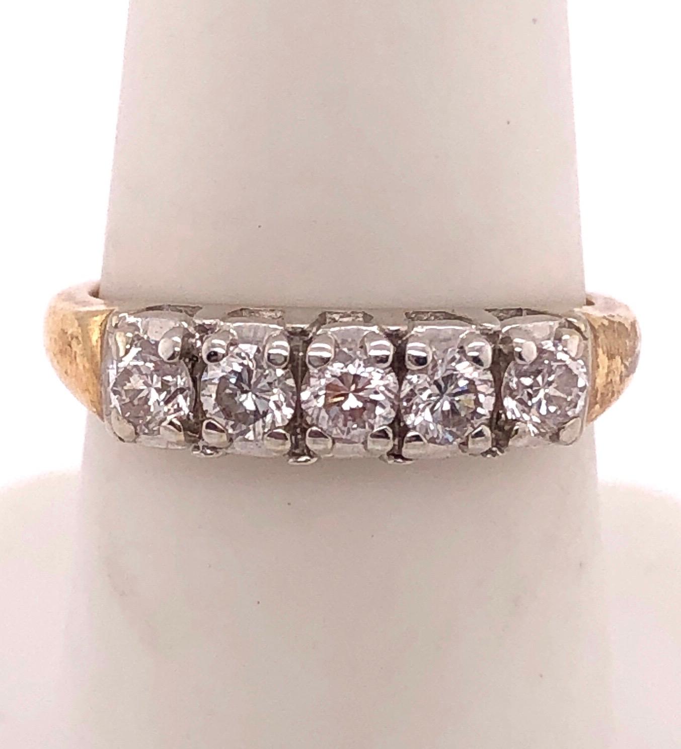 14Kt Two Tone Yellow And White Gold Ring Wedding Band with Five Diamonds 1.00TDW 
Size 6.5 
2.81 grams total weight.
