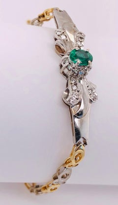 14 Karat Two-Toned Emerald Fancy Link Bracelet .66 Total Diamond Weight
