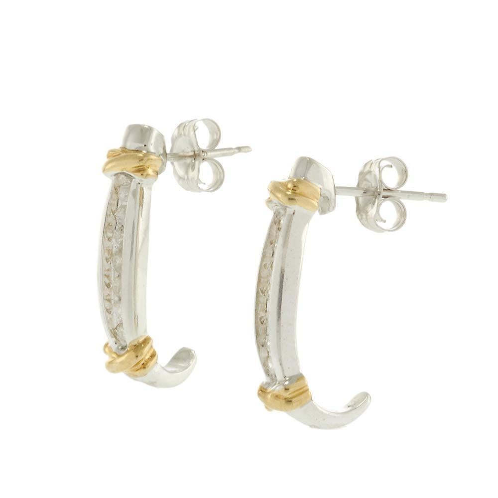 Elegant and timeless, these 14KT two-tone diamond half-hoop earrings feature a row of round brilliant diamonds totaling approximately 0.25 carats. Crafted in polished white gold and accented with twisted yellow gold detailing at the ends, the design