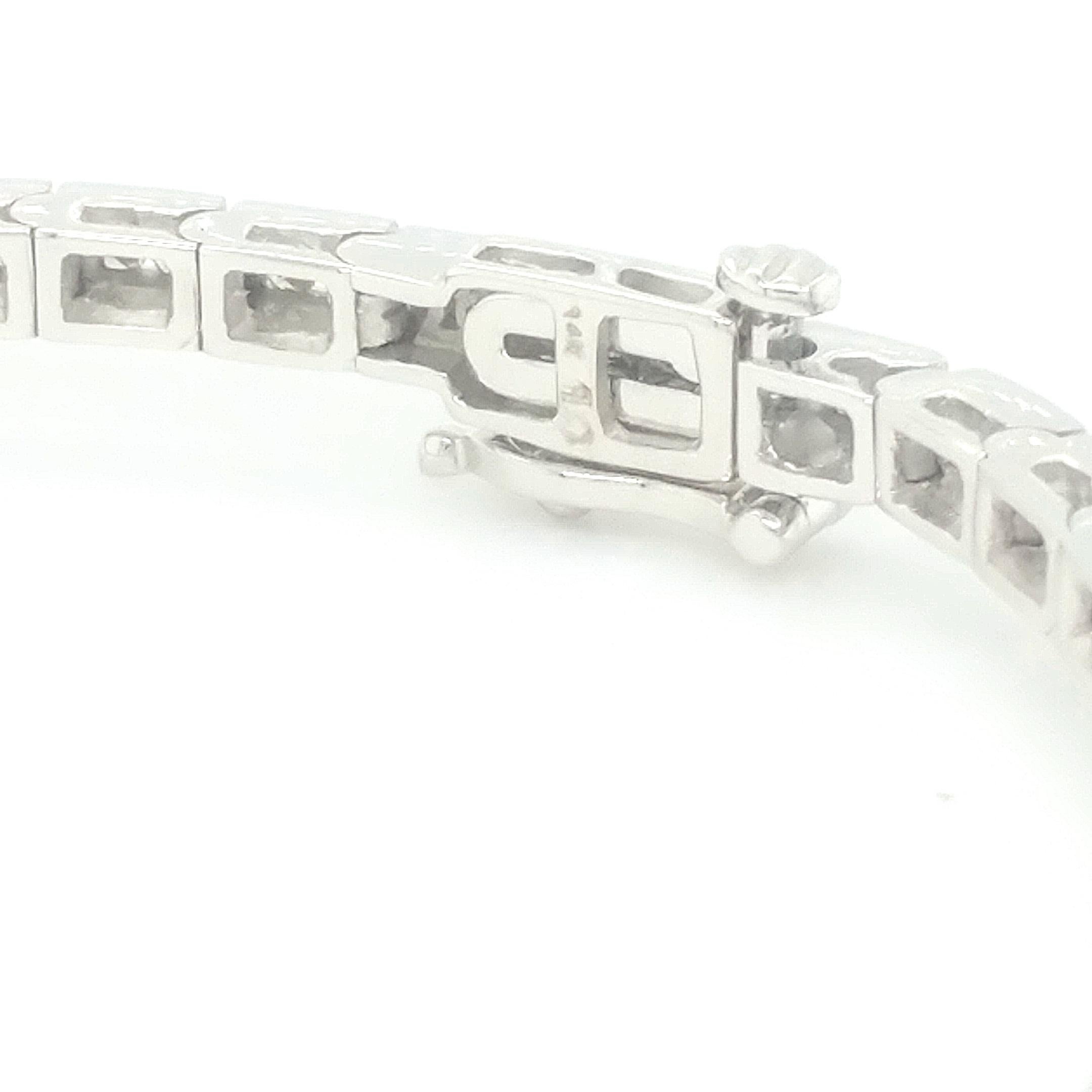 A beautiful white gold bracelet set with round brilliant cut white diamonds. This bracelet is studded with 96 round brilliant cut diamonds. All the stones are channel set. The total diamond weight is 1.00ct. The white diamonds are H-I color and