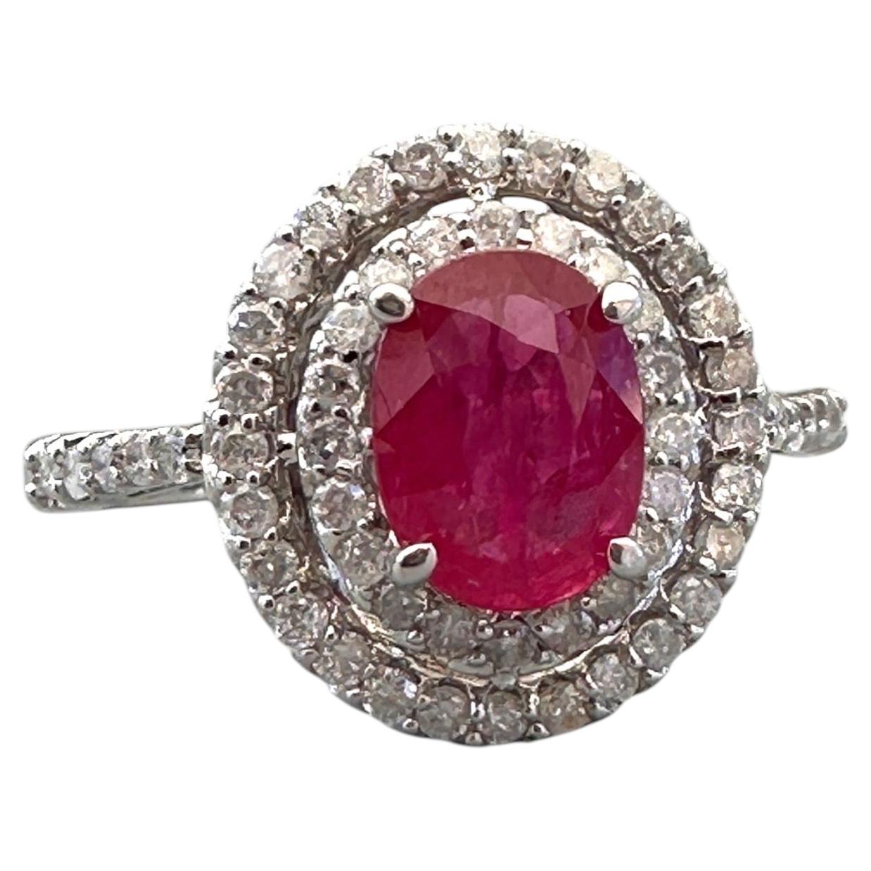 14kt White Gold 1.40 Carat Oval Ruby and Double Diamond Halo Cocktail Ring For Sale