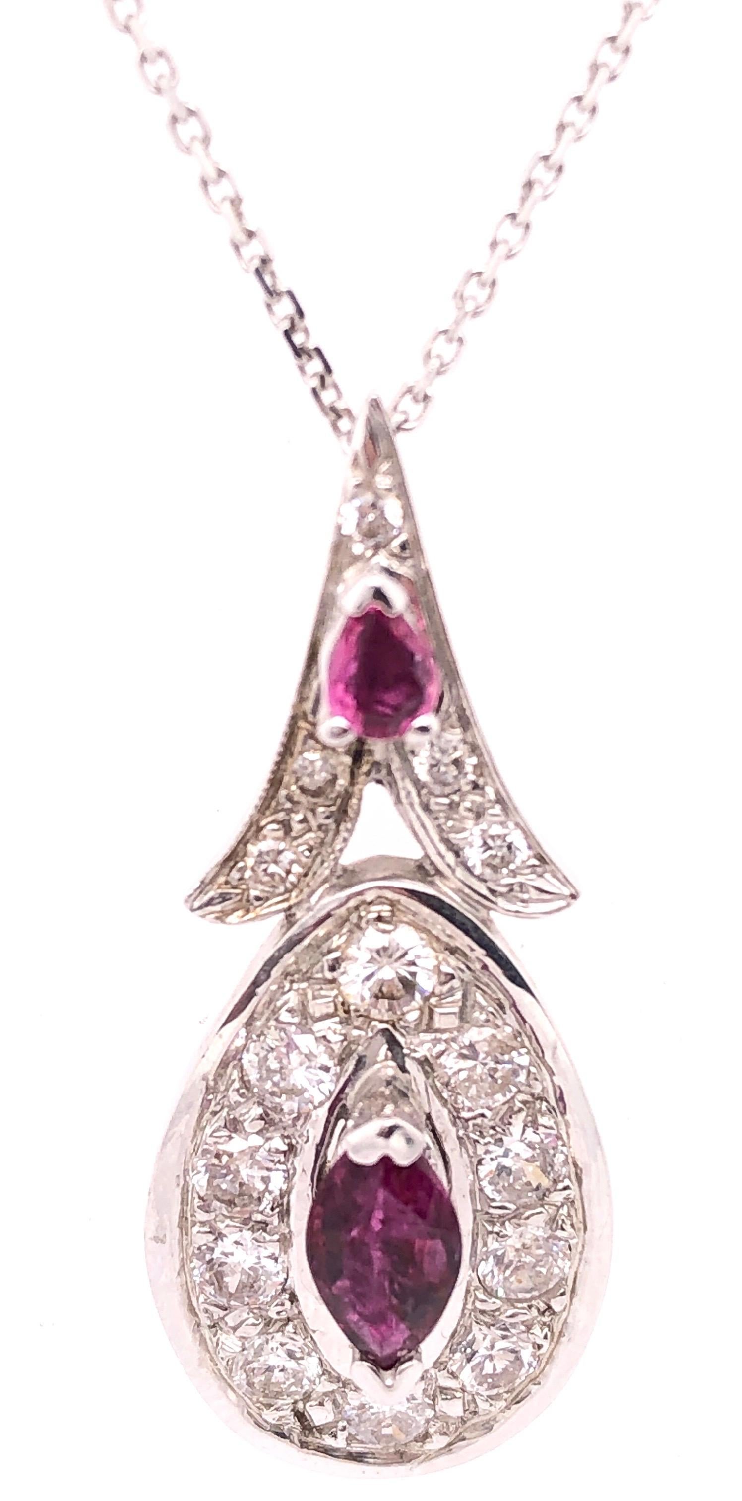14Kt White Gold Charm 18 inch Necklace with Diamond And Ruby Pendant
1.25 Total Diamond Weight 
0.20ct Ruby Weight
6.53 grams total weight