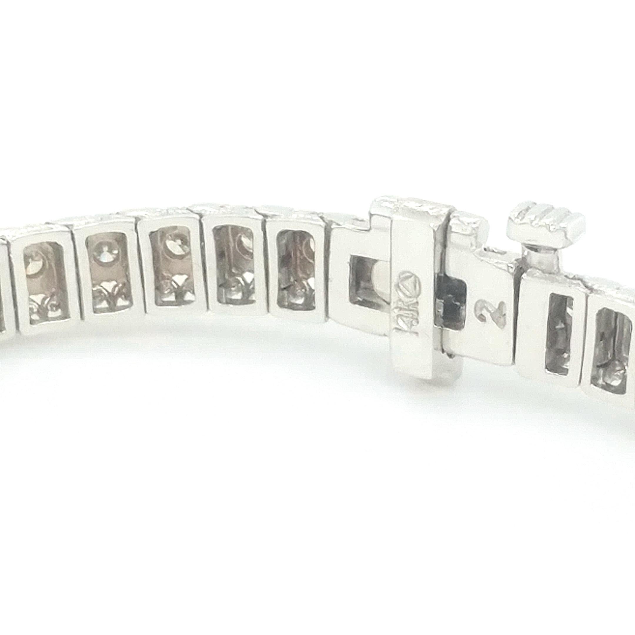 A beautiful white gold bracelet set with round brilliant cut white diamonds. This bracelet is studded with 57 round brilliant cut diamonds. All the stones are prong set. The total diamond weight is 2.00ct. The white diamonds are H-I color and SI2/I1