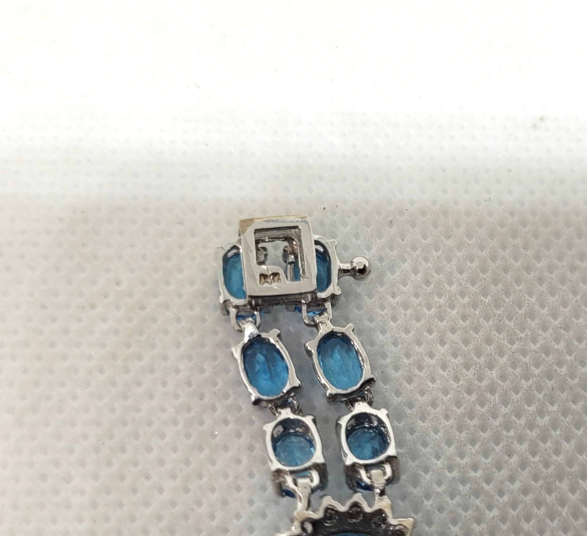 Modern 14kt White Gold 50.50cttw Oval Natural Blue Topaz & 1.60cttw Diamond Bracelet For Sale