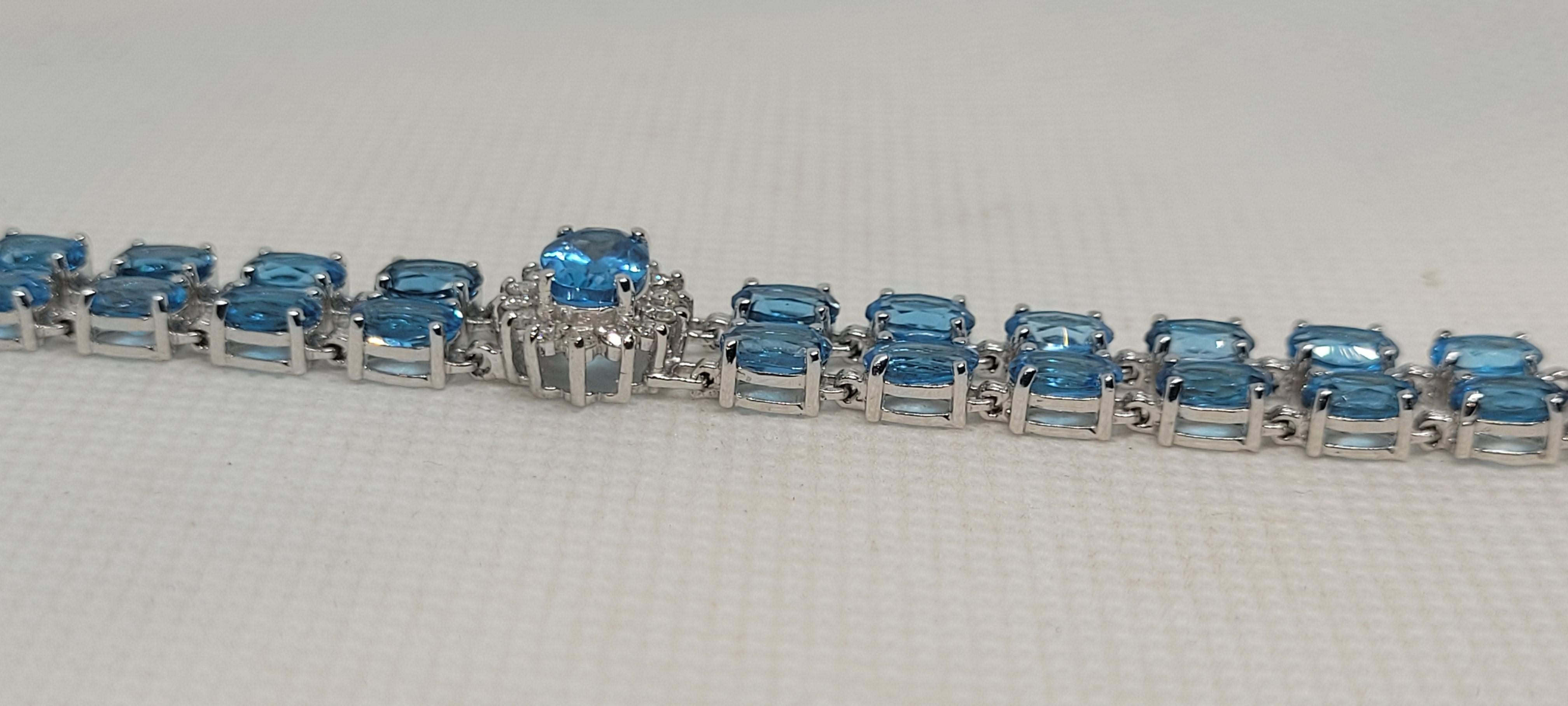 14kt White Gold 50.50cttw Oval Natural Blue Topaz & 1.60cttw Diamond Bracelet In Good Condition For Sale In San Diego, CA