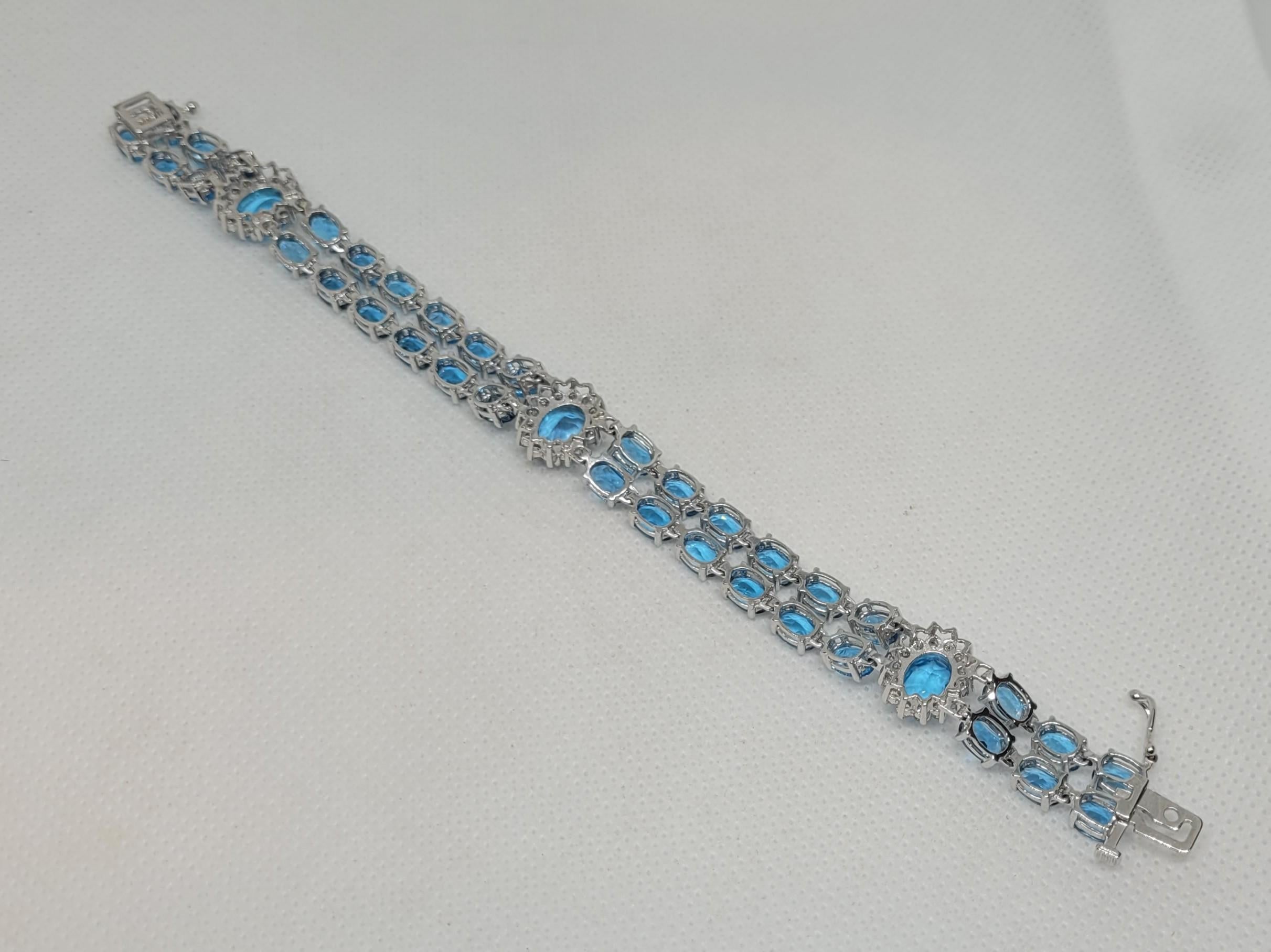 Women's 14kt White Gold 50.50cttw Oval Natural Blue Topaz & 1.60cttw Diamond Bracelet For Sale