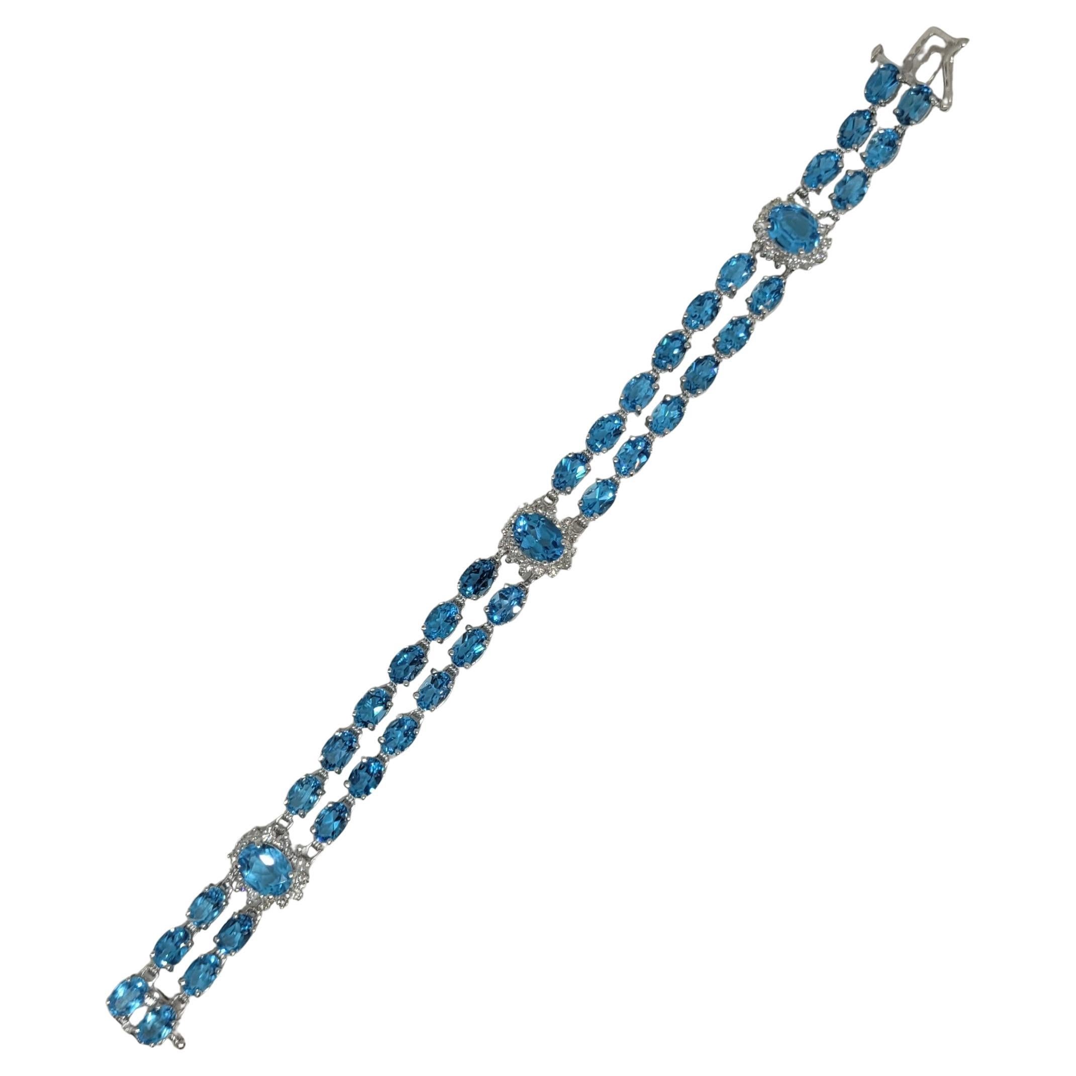14kt White Gold 50.50cttw Oval Natural Blue Topaz & 1.60cttw Diamond Bracelet For Sale