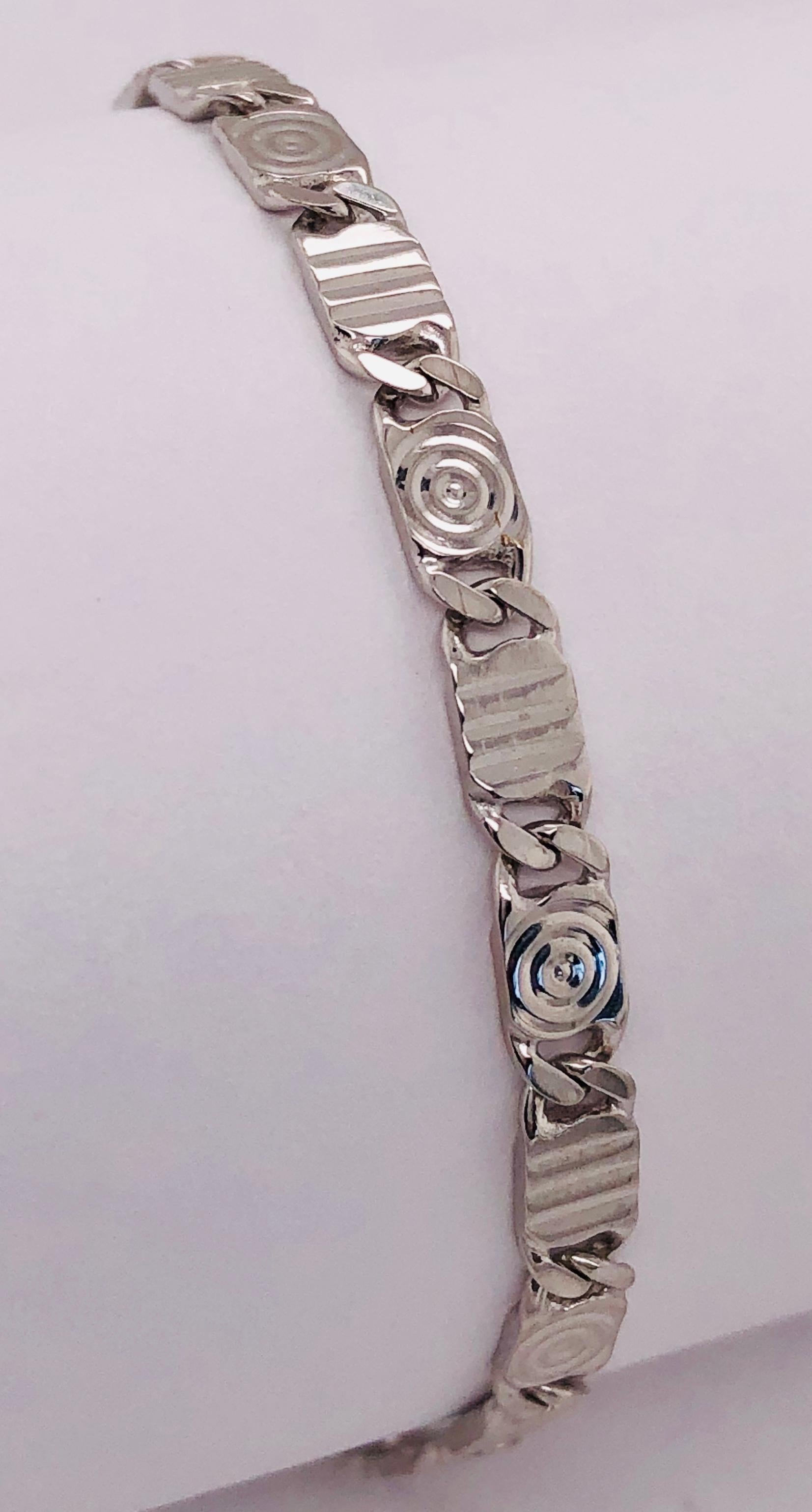 bracelet à maillons fantaisie de 7 pouces en or blanc 14Kt
poids total de 9 grammes