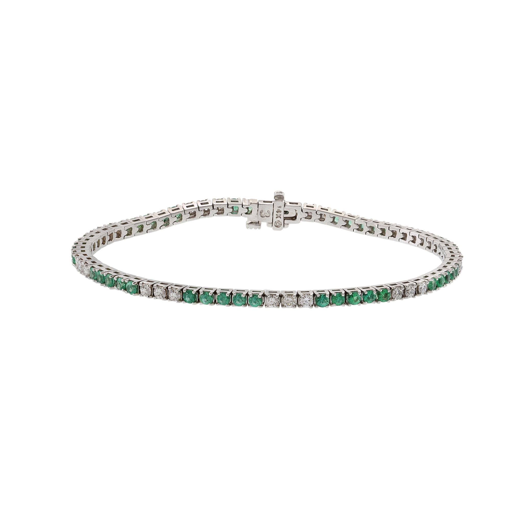 14kt white gold alternating emerald and diamond straight line bracelet. consisting of 1.69ct-tw round cut genuine emeralds and 1.14ct-tw g-vs/si round brilliant cut diamonds.