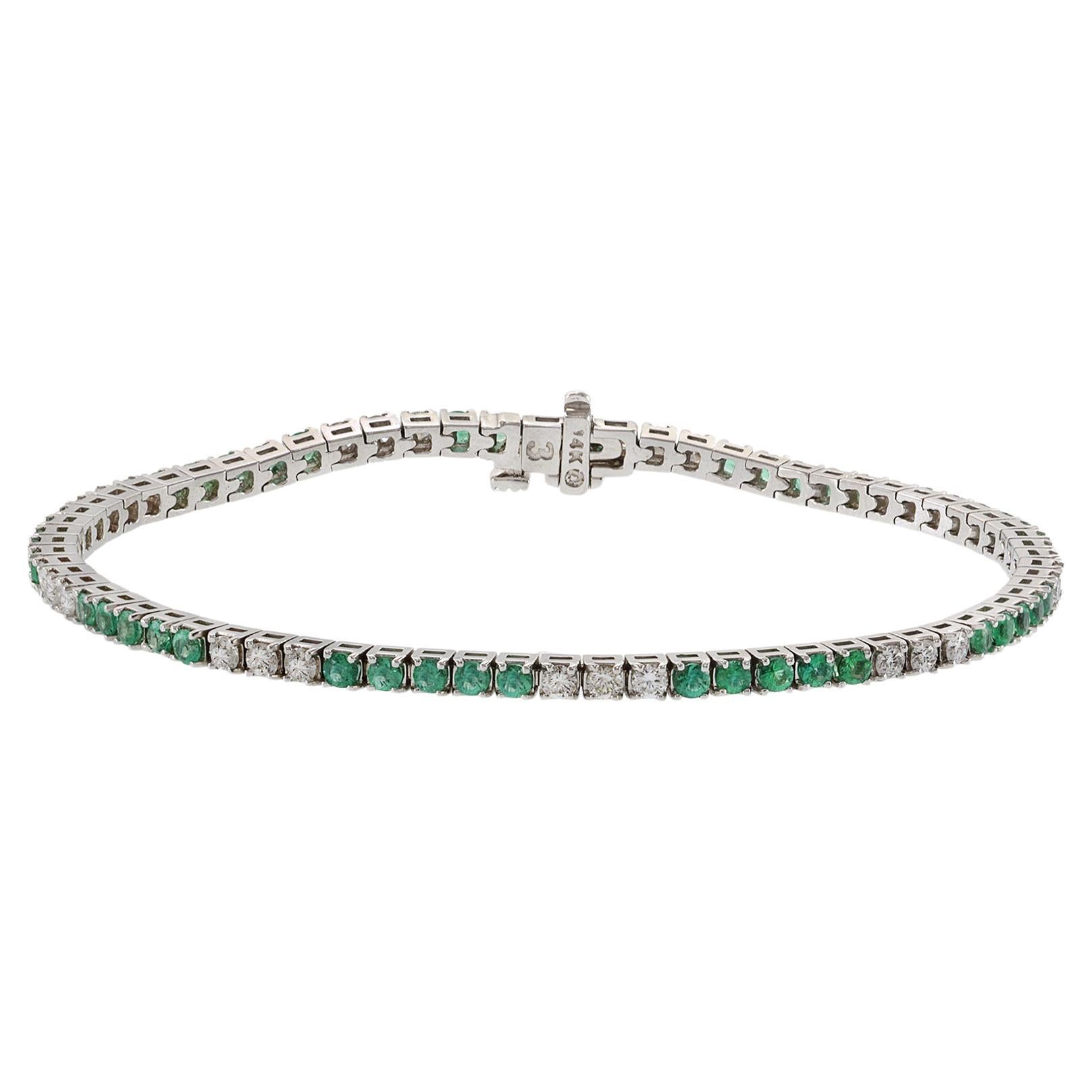 Bracelet droit en or blanc 14 carats alternant émeraudes et diamants
