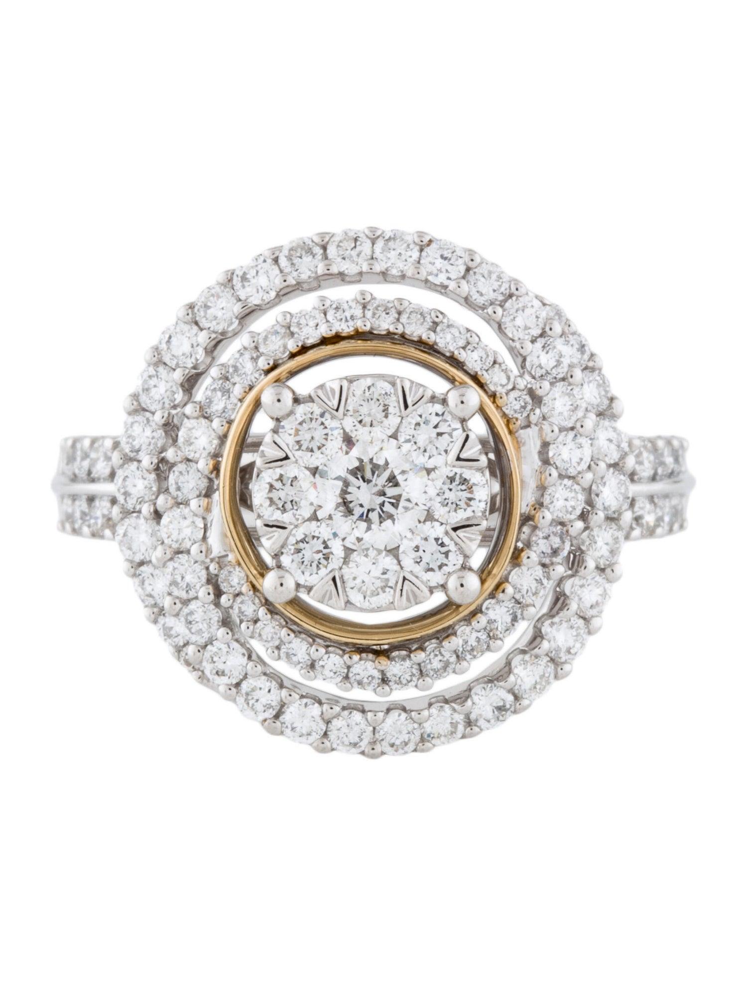 A beautiful 14kt white and yellow gold diamond cluster ring featuring 1.25 Carats of Round Brilliant Diamonds. There are 93 round brilliant cut diamonds set in this cluster ring. Nine diamonds in the center are pressure set and the remaining