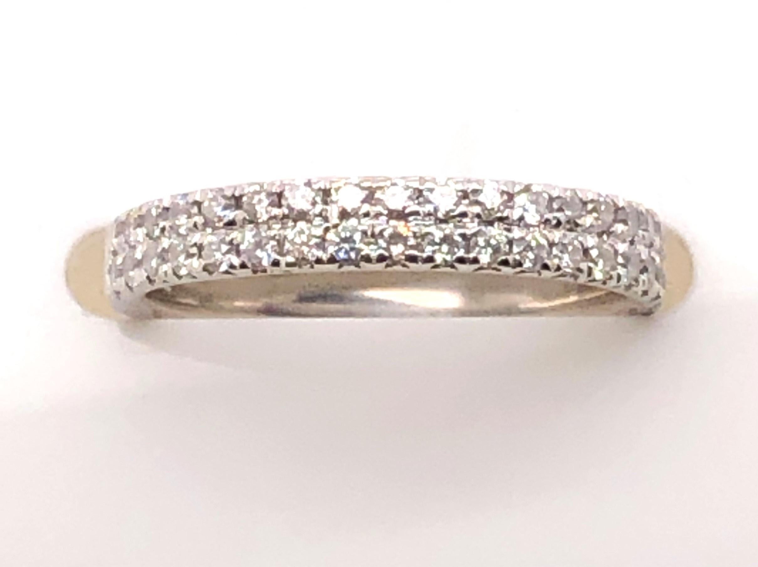 Simple and elegant, this estate diamond double row band adds the sparkle you want to any ring stack! The ring is all solid 14kt white gold with approximately .38 carats of micro-prong set diamonds. The diamonds are H-I color and SI1-I1 Clarity. This