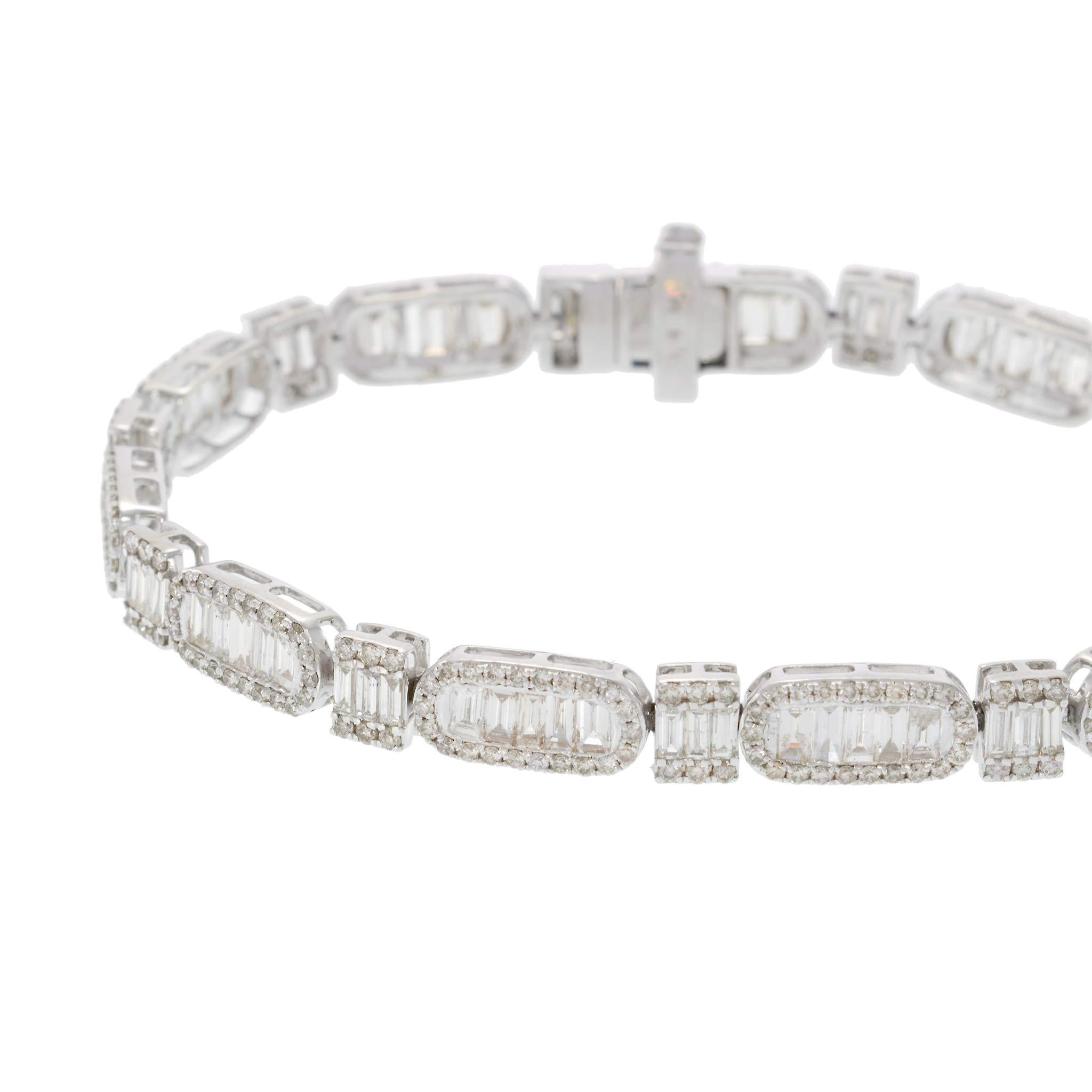 A stunning bracelet crafted in 14k white gold.

This piece features 6.48 carats of baguette-cut diamonds, exhibiting a pristine white hue. The diamonds are of G color grade and VS2 clarity, beautifully set to catch the light.

Round-cut diamonds,