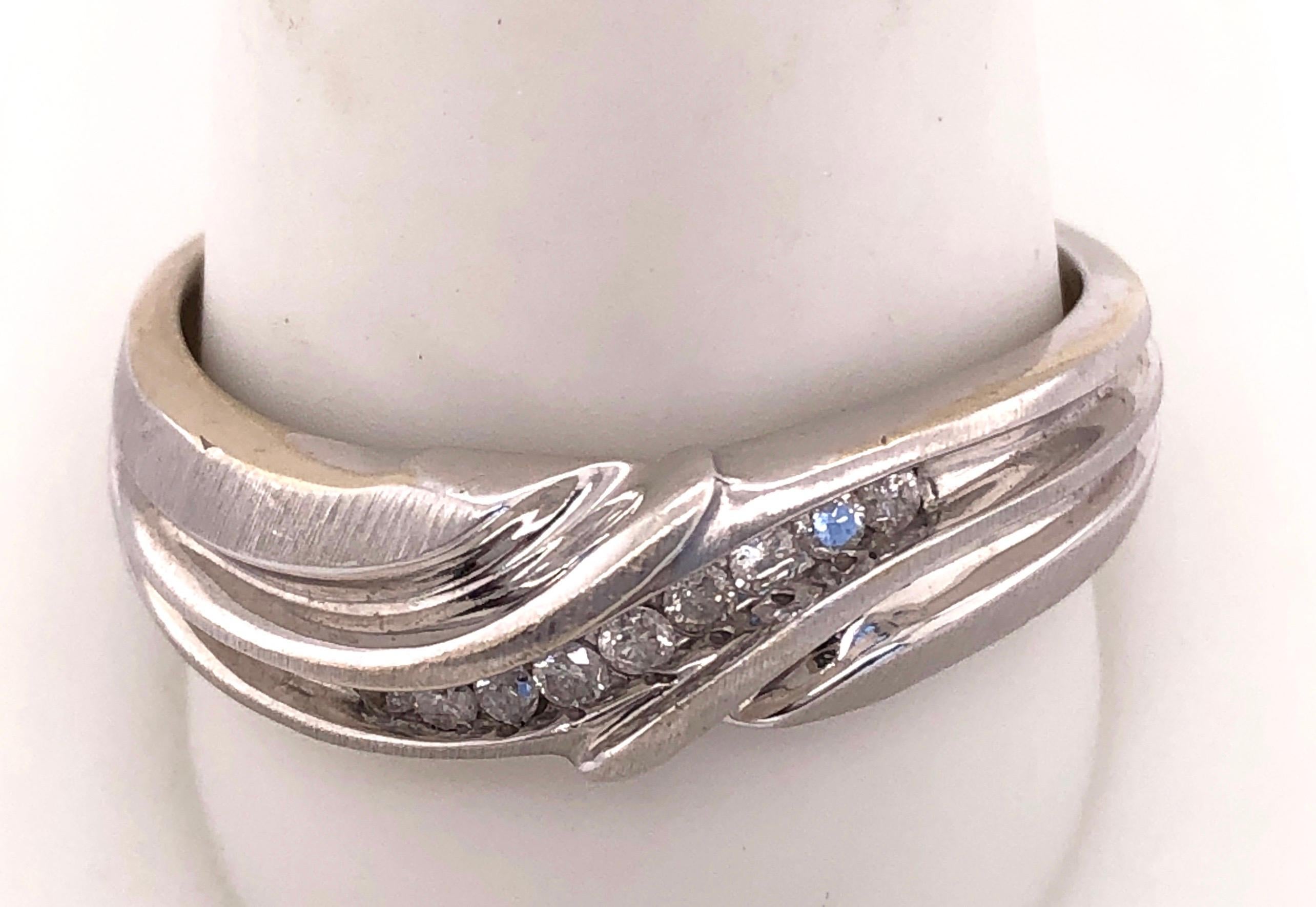 14Kt White Gold Band Ring with Diamond 0.20 Total Diamond Weight
Size 11.5 with 6 grams Total weight