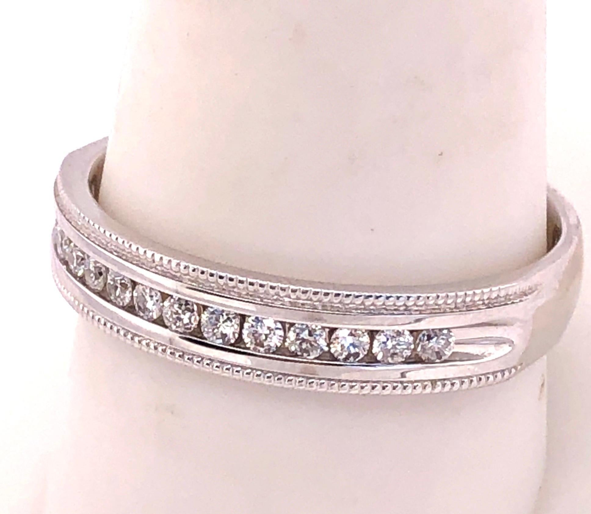 14Kt White Gold Band Ring with Diamonds  0.25 Total Diamond Weight
Size 10.25 with 4.99 grams total weight