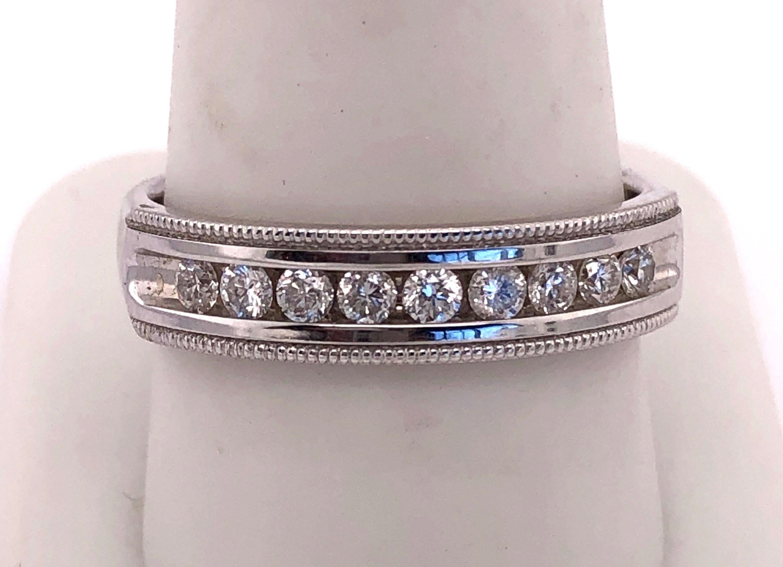 14Kt White Gold Band Ring with Diamonds
6.69 grams total weight