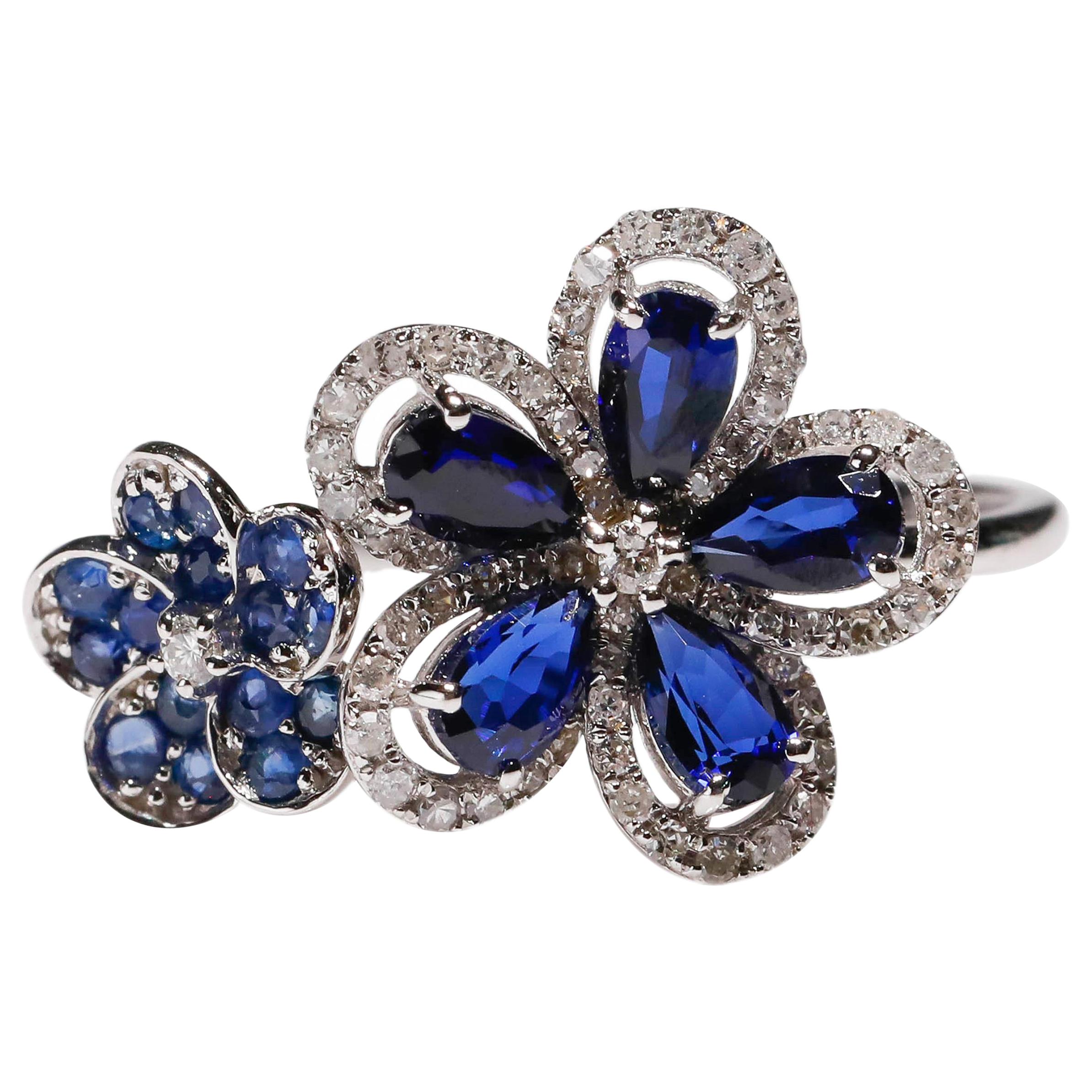 14 Karat White Gold Blue Sapphire 0.29 Carat Diamond Double Flower Bridal Ring

Crafted in 14kt White Gold, this Unique design showcases a Blue Sapphire Floral designs, set in a halo of round-cut mesmerizing diamonds, Polished to a brilliant