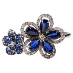 14 Karat White Gold Blue Sapphire 0.29 Carat Diamond Double Flower Bridal Ring