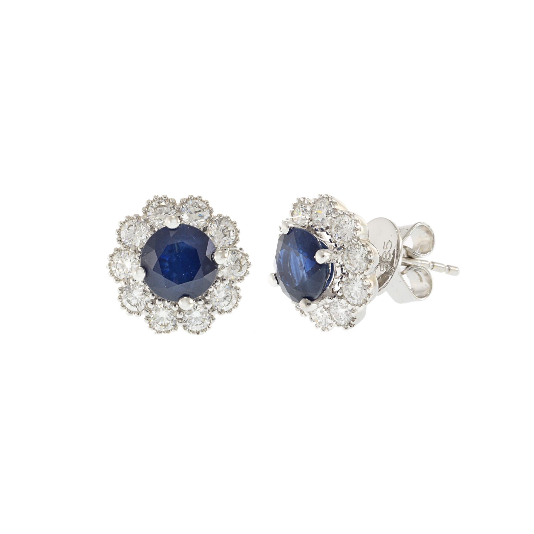 Modern 14KT White Gold Blue Sapphire and Diamond Halo Earrings For Sale