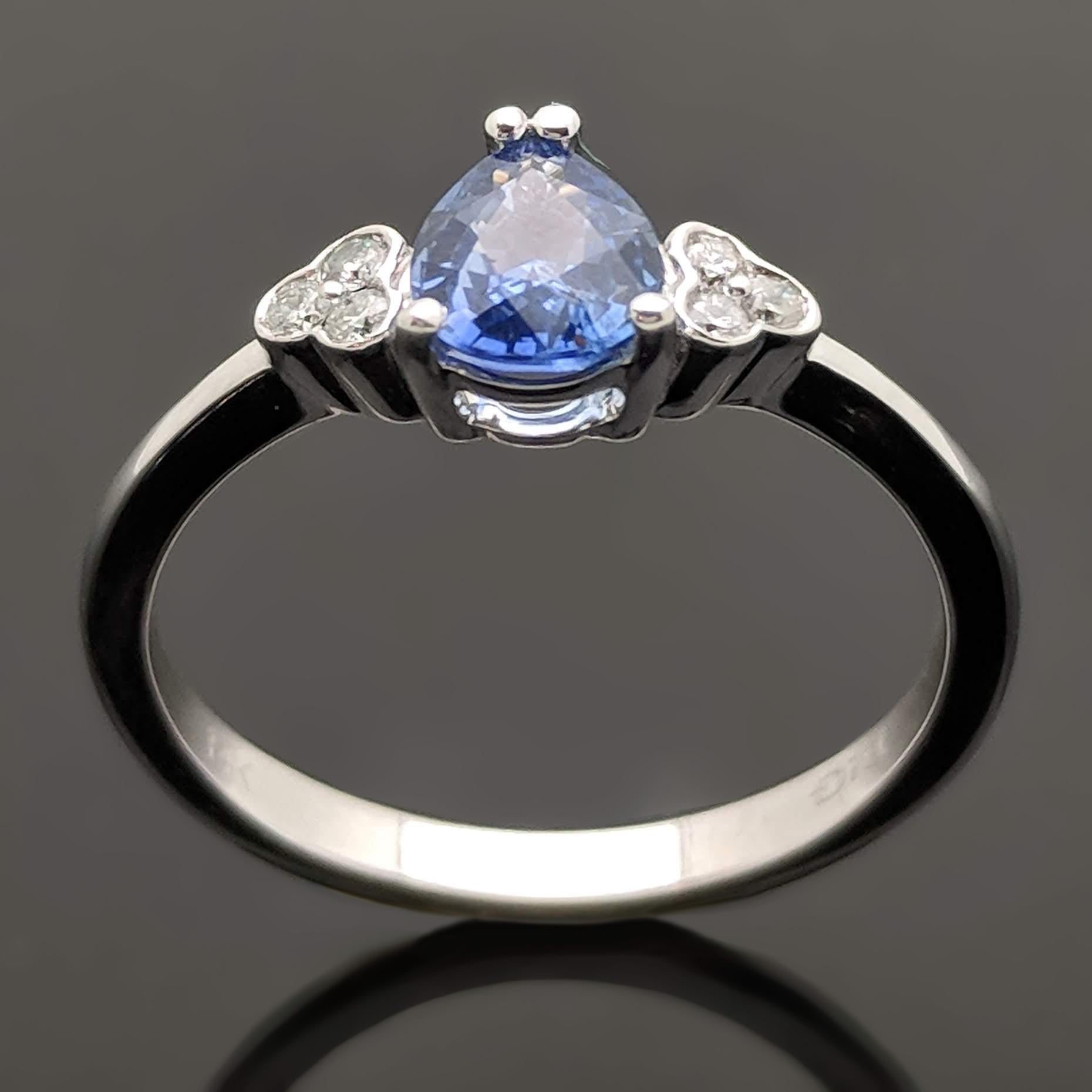 A 14kt white gold ring setting with a gorgeous pear-cut blue sapphire estimated at 0.74ct. The sapphire has 3 bezel-set diamonds on each side with an estimated 0.07cttw. Estimated weight of gold is 2.3 gr. 

We will size it for you.