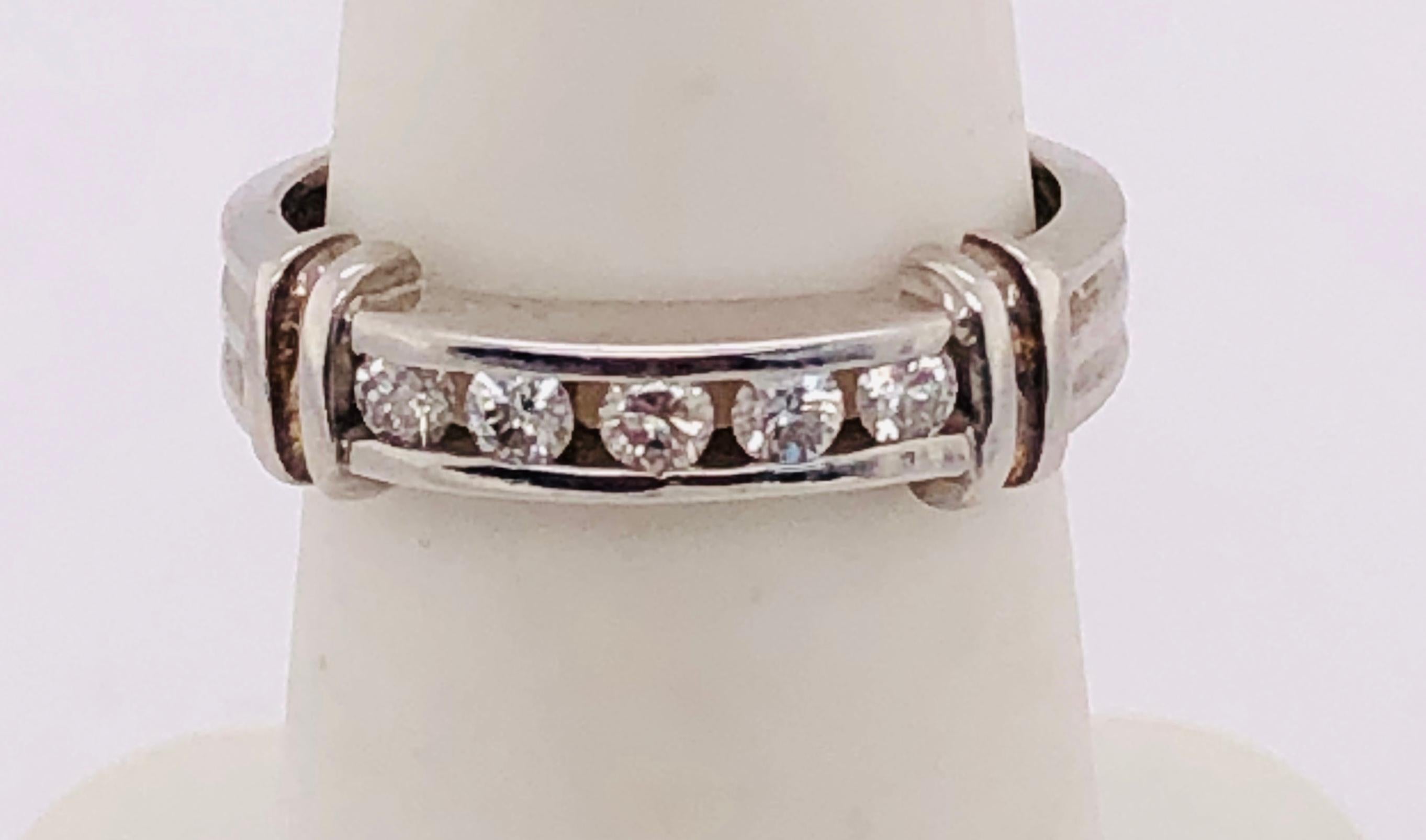 14Kt White Gold Channel Set Ring with Diamonds 0.23 Total Diamond Weight
Size 5 
2.90 grams Total weight