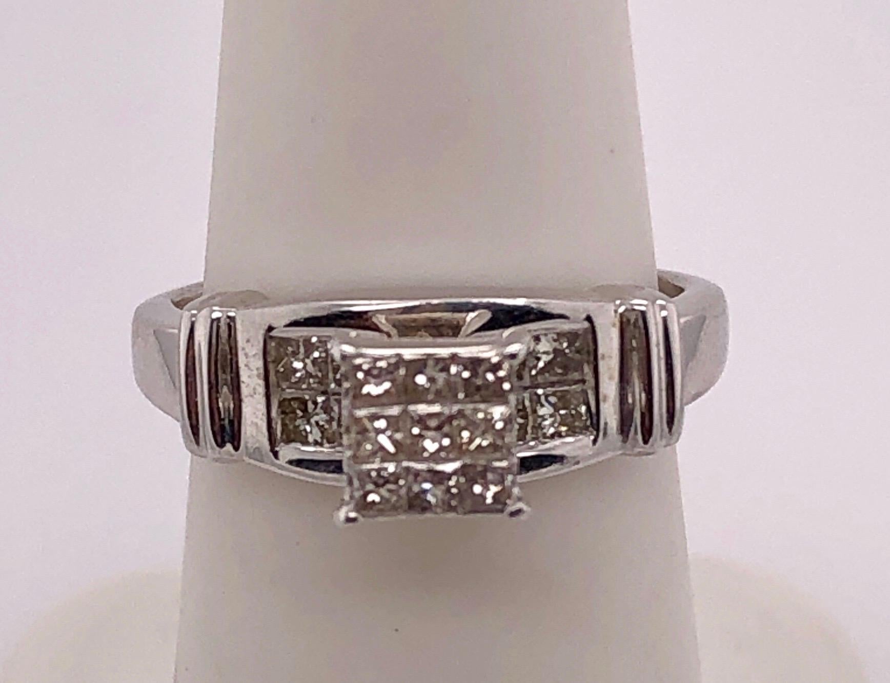 14Kt white Gold Contemporary Ring 1.00 Total Diamond Weight
Size 5.75 with 3.72 grams total weight.