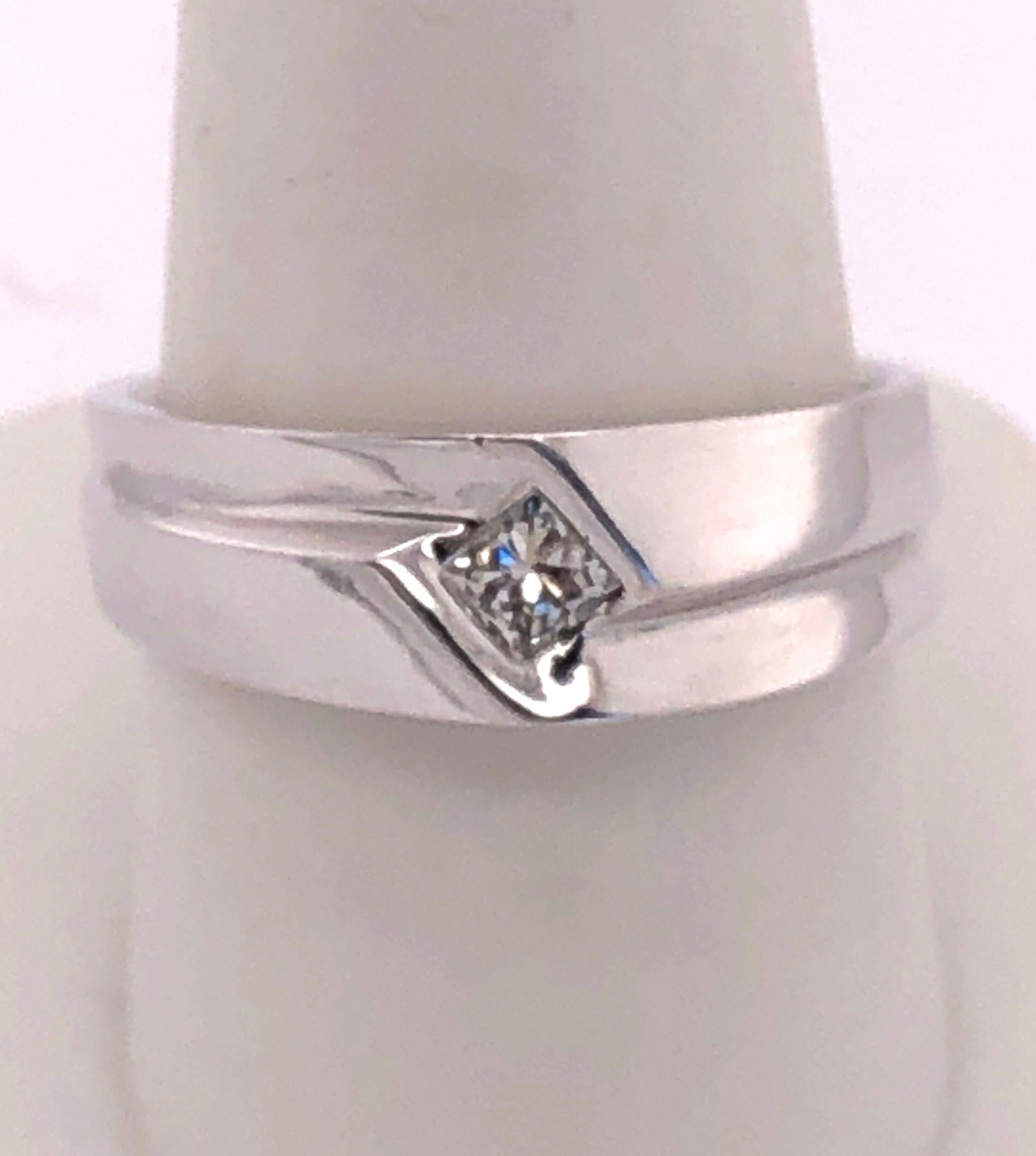 14Kt White Gold Contemporary Ring with Diamond 0.25 Total Diamond Weight
Size 9.5 with 9 grams total weight.