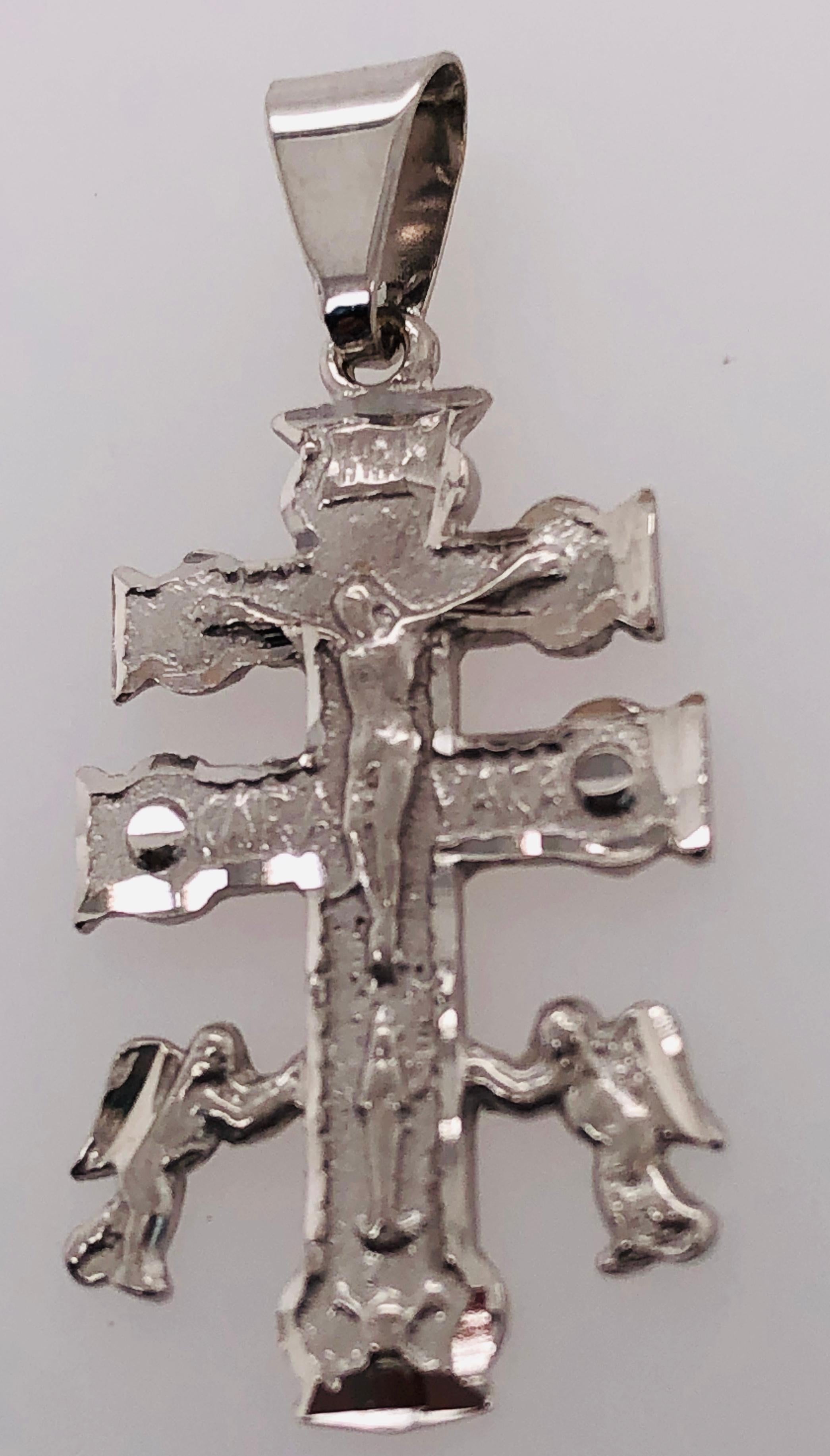 14Kt White Gold Cross / Religious Pendant
2.00 grams total weight 15 mm by 32 mm at its widest points. 