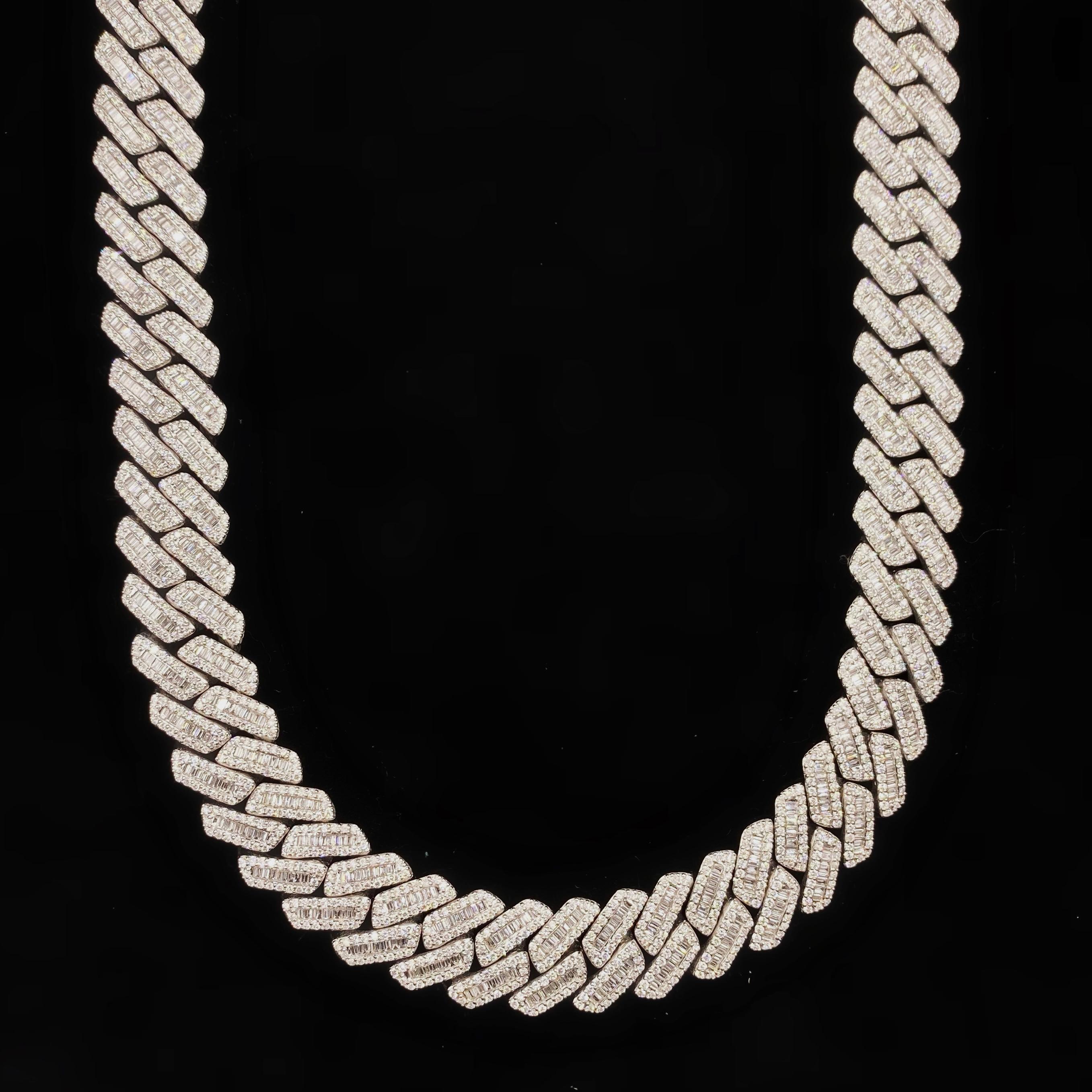 14kt White Gold Cuban Link Chain

Crafted in 14kt white gold 
31.20ct total weight diamonds
Round and emerald brilliant cut diamonds
Color/Clarity:F/G-VS2/SI1
256 g
Natural diamonds