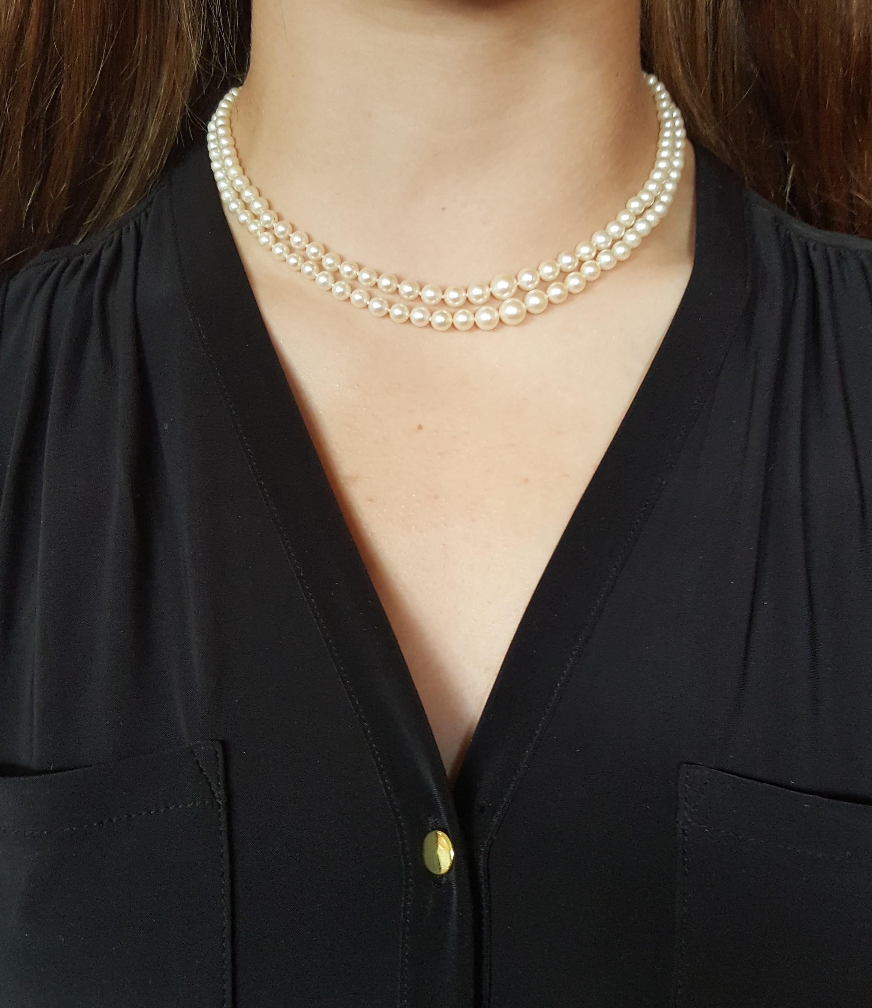 Vintage double strand white cultured pearl necklace, graduating in size from 7mm to 3.8mm. The pearls range in size from 16.5 inches to 17.5 inches secured with a 14kt white gold clasp. This pearl necklace is timeless and makes a perfect addition to