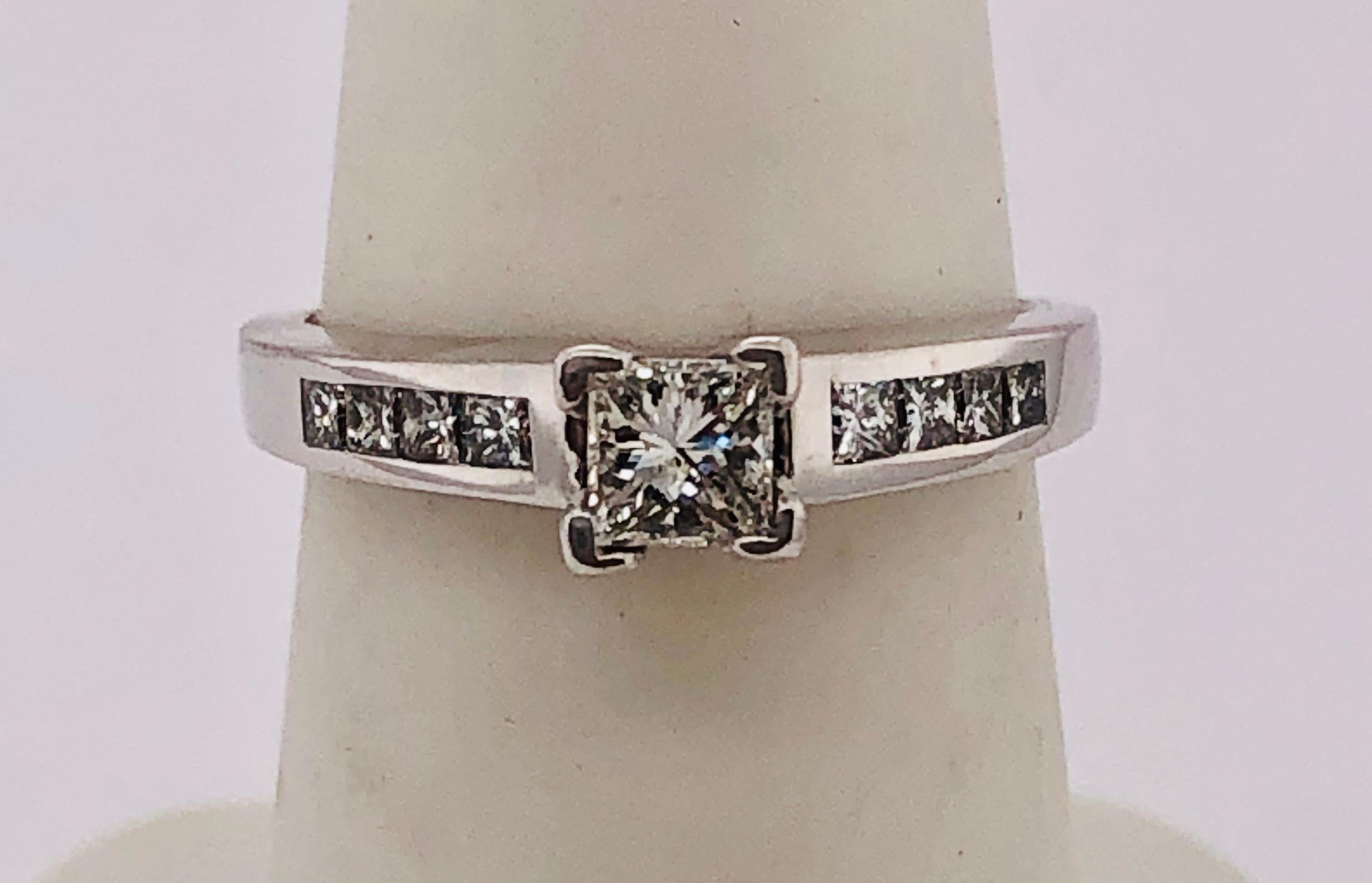 14Kt White Gold Diamond Engagement Ring 1.40 Total Diamond Weight. The center stone is half a carat. 
Size 6.5 with 3.7 grams total weight.