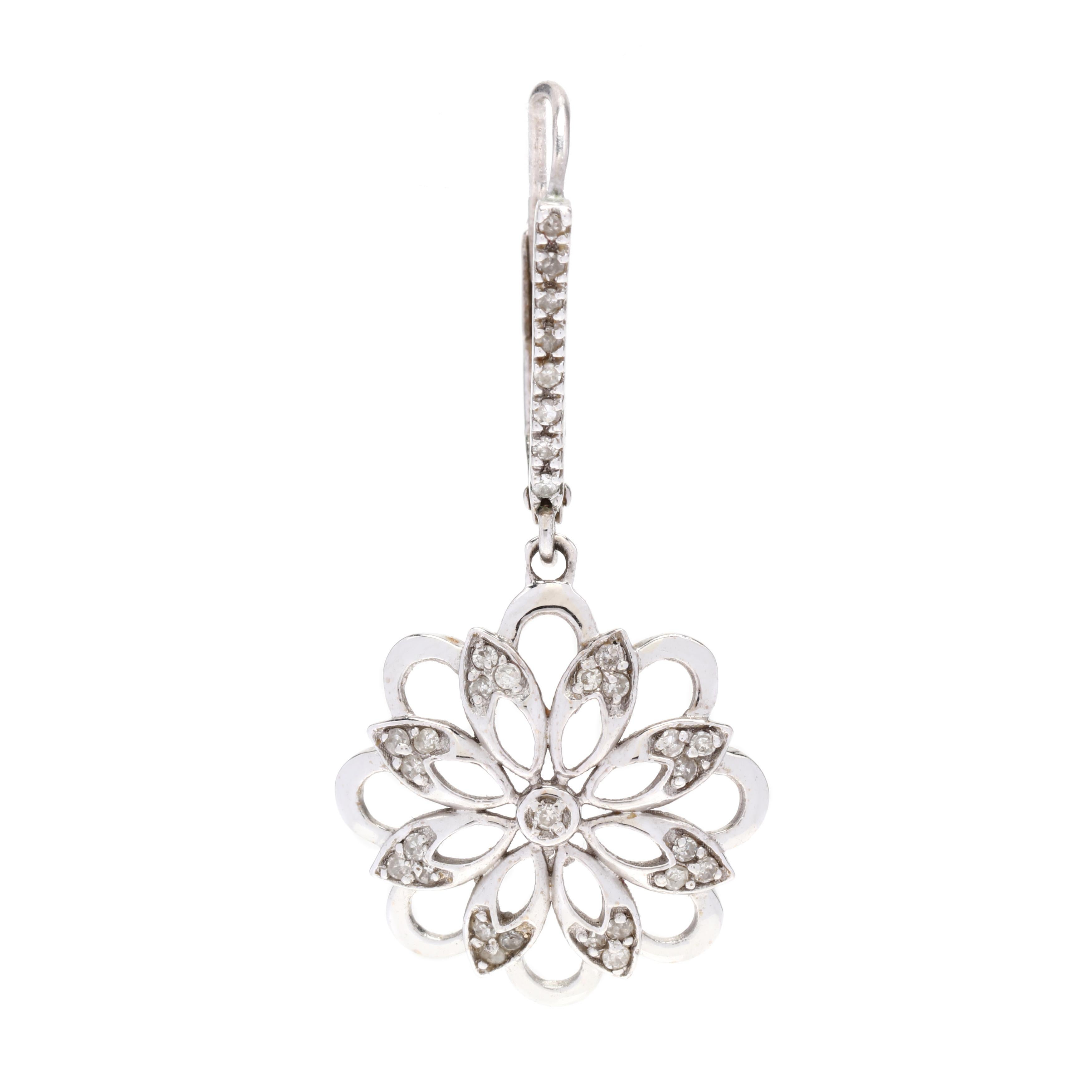 A pair of 14 karat white gold diamond flower dangle earrings. These earrings feature an open floral design suspended from ear wires with latch backs and set with single cut round diamonds weighing approximately .33 total carats.



Stones:

-