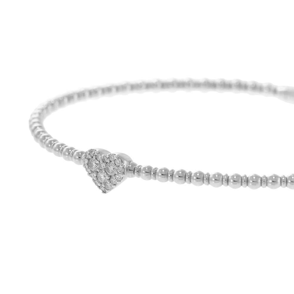 Charming and romantic, this 14KT white gold flex bangle features a pavé-set diamond heart centerpiece, delicately nestled among polished gold beads. With 0.18 carats of round brilliant diamonds, this piece combines everyday comfort with sweet