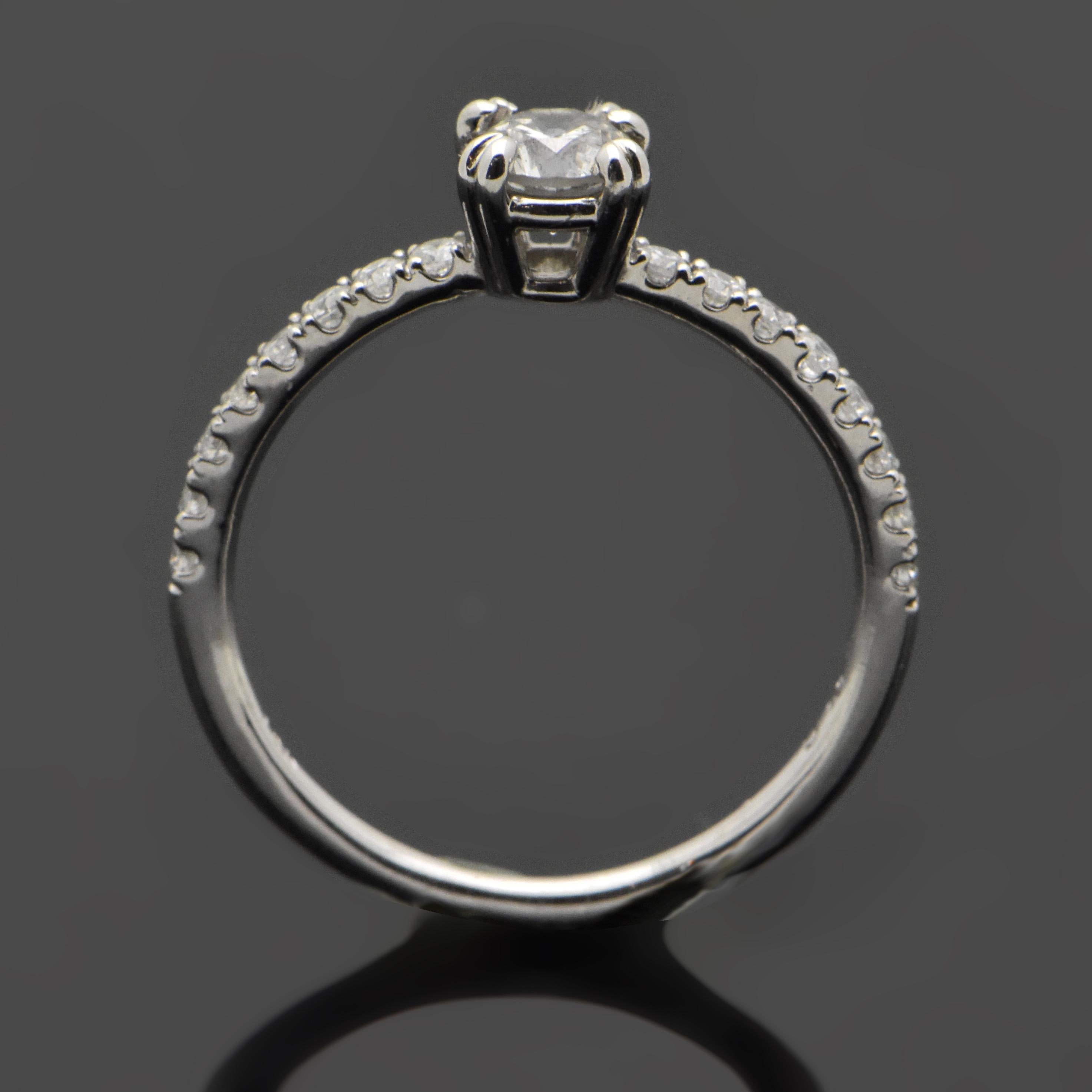 14kt White Gold Diamonds Ring. This ring features a round brilliant cut diamond with double prongs and 8 diamonds down each shank set in white gold.

This item is a custom order only. Price for the ring setting only. The stones will be priced