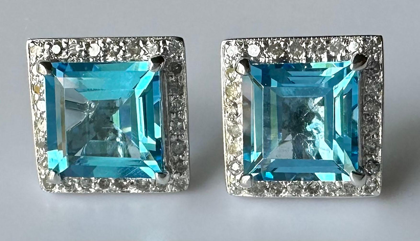 14kt White Gold Earrings set with Blue Topaz & White Sapphire Rounds. These lovely earrings are a medium blue color accented by tiny white Sapphire round accent stones. The Topaz are cut in a square step cut.

Originally from San Diego, California,