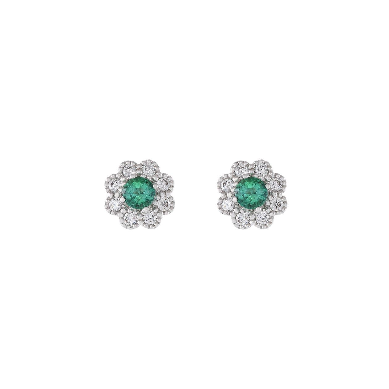 In these beautiful 14kt white gold flower earrings, you'll find two round-cut genuine emeralds, totaling 0.40 carats, at the heart of the design. These vibrant emeralds are elegantly encircled by beaded prong-set round-cut diamonds, weighing a