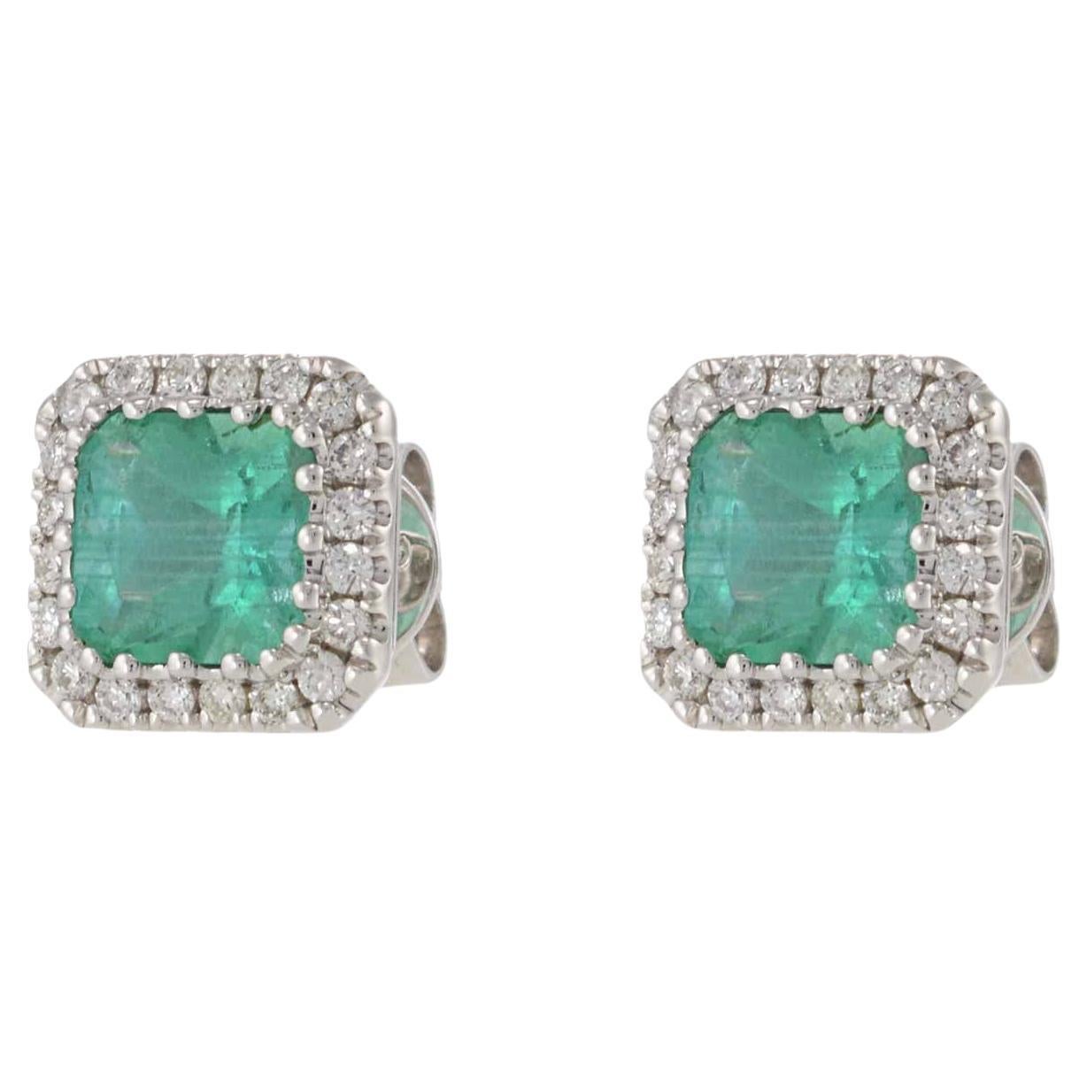 14KT White Gold Emerald and Diamond Halo Earrings